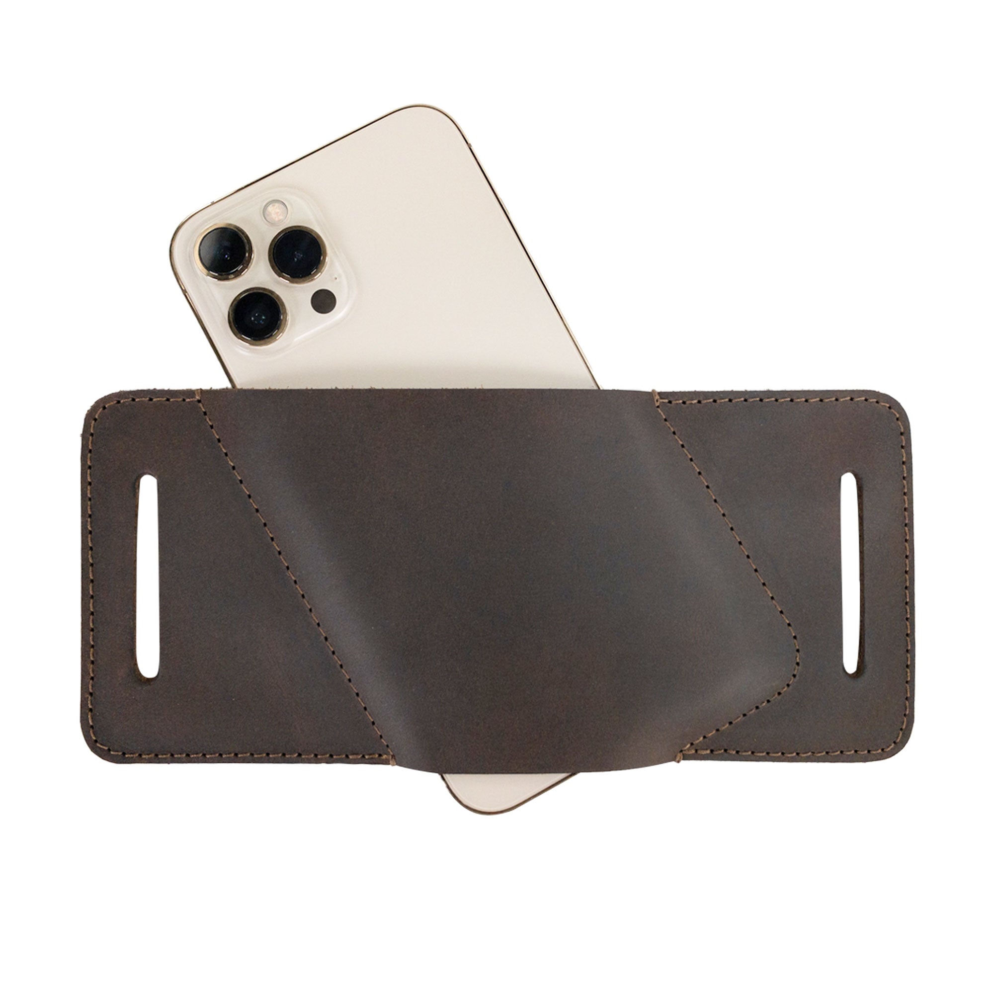 Rustic Waist Holster for Apple iPhone 14 Pro Max by Hide & Drink, with an iPhone partially inserted. Made from durable Full Grain Leather, this artisanal Waist Holster for Apple iPhone 14 Pro Max is hand cut and fire branded, reflecting small batch production in La Antigua Guatemala & Oaxaca Mexico.