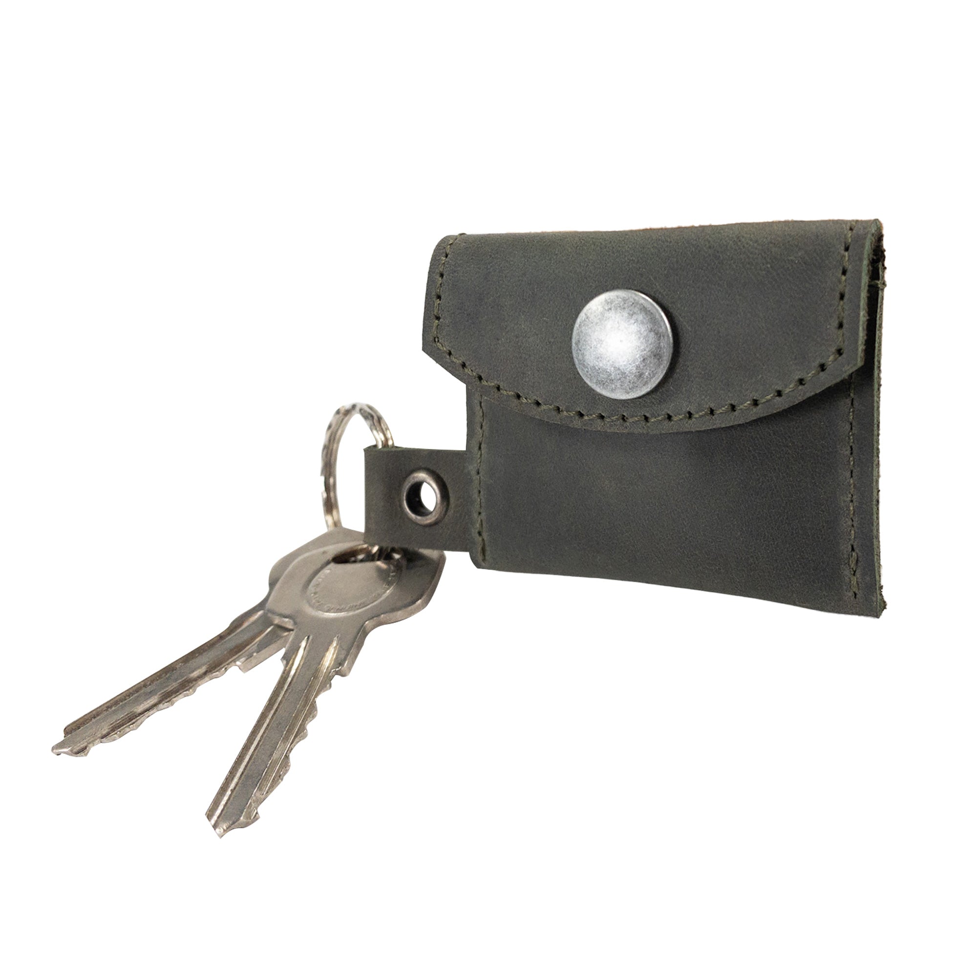 The full perspective of the Tiny Coin Holder Keychain by Hide & Drink showcases its fine craftsmanship in Full Grain Leather. This Tiny Coin Holder reflects small batch production and artisan dedication.
