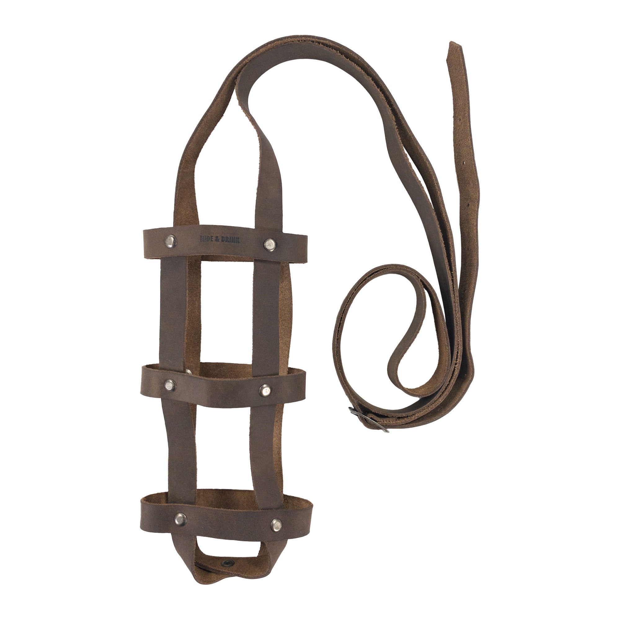 The Hide & Drink Riveted Bottle Carrier (Bottle Included) displayed in a unique leather design, ideal for carrying your bottle effortlessly. This full grain leather travel accessory showcases the dedication to small batch production, hand cut, hand sewn, and fire branded techniques by artisans in La Antigua Guatemala & Oaxaca Mexico.