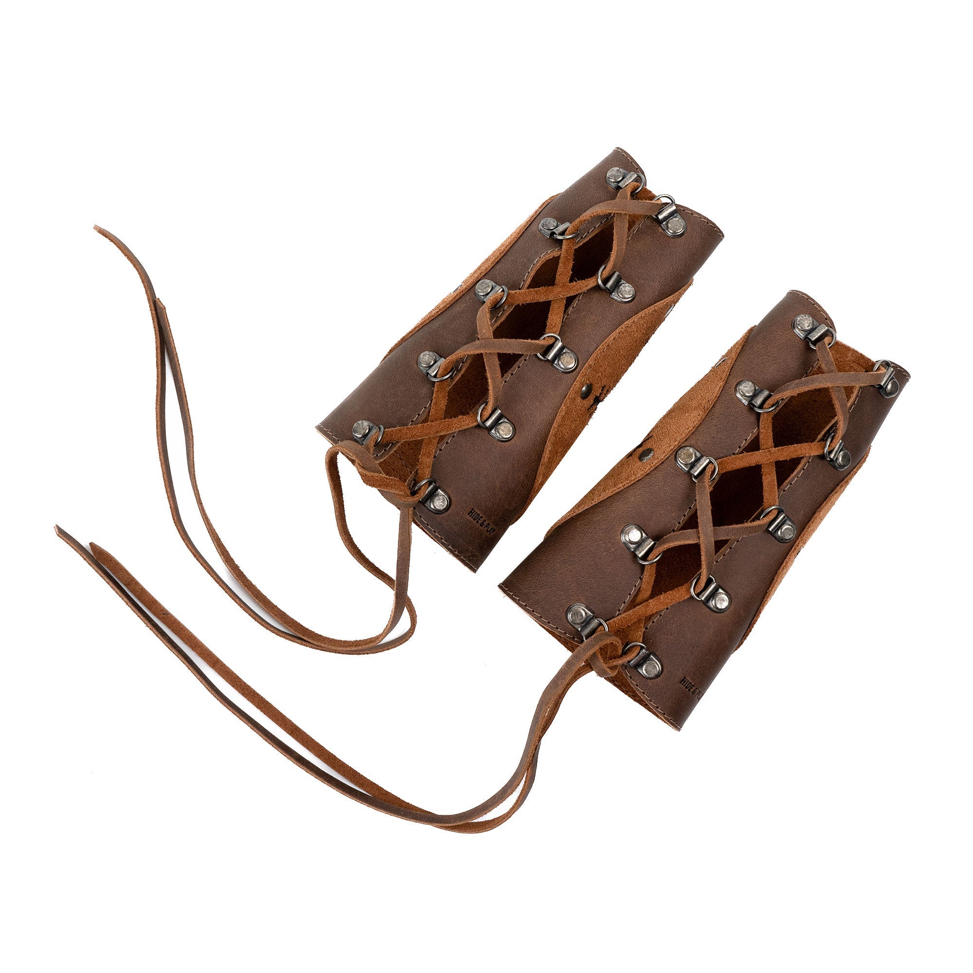 A detailed view of Viking Bracers by Hide & Play showcasing their unique lace-up design, representing a set of 2 Viking Style Bracers. These arm protectors for costume are crafted from full grain leather, perfect for cosplay, handmade through small batch production in La Antigua Guatemala & Oaxaca Mexico.