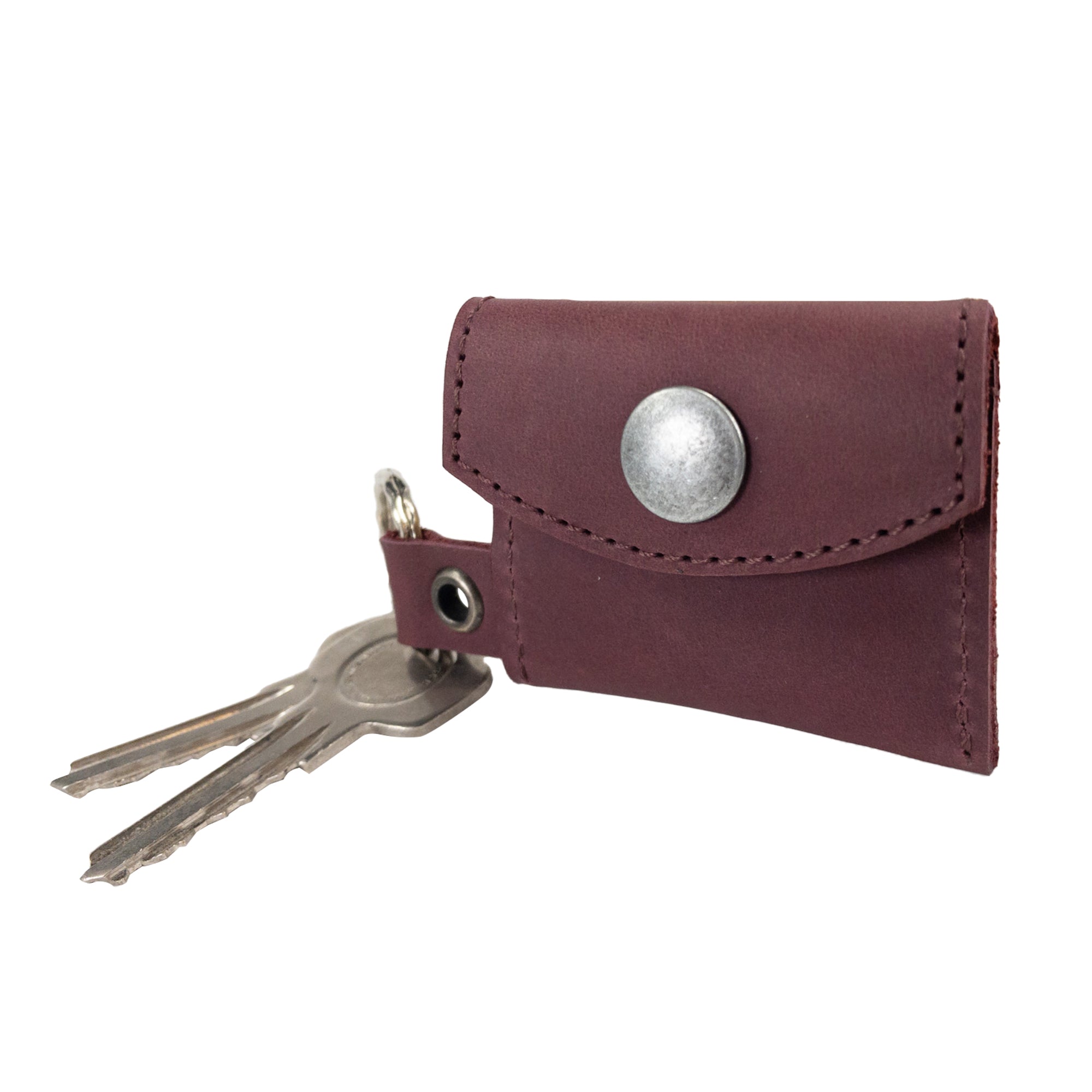Another view of the Tiny Coin Holder Keychain by Hide & Drink accentuates its premium Full Grain Leather design. This Tiny Coin Holder exemplifies artisan dedication in small batch production.