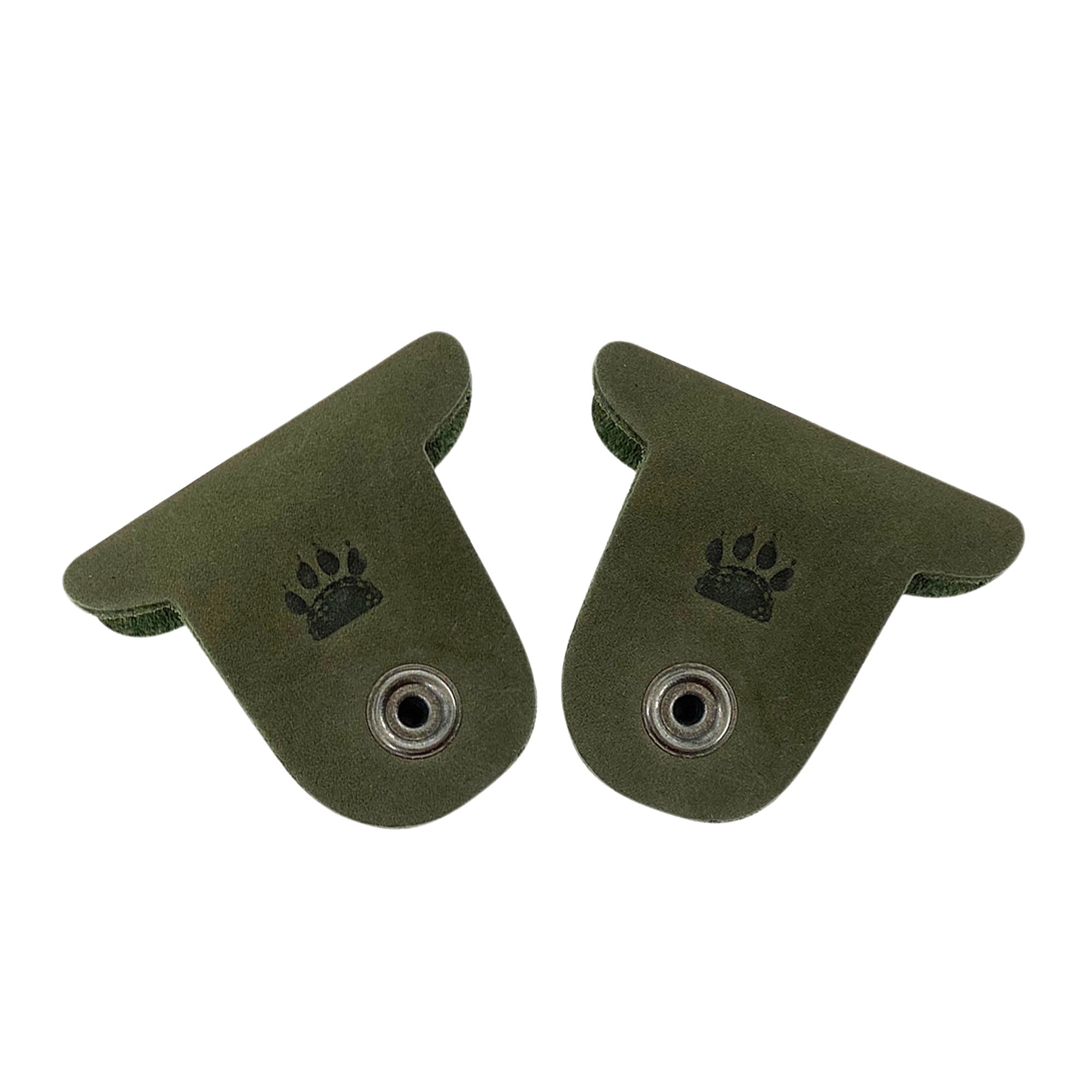 Two green Dog Cord Keepers by Taco Dog, perfect for managing your headphones and chargers on-the-go. Made from premium full grain leather, these artisan-crafted accessories clip together easily for travel. Enjoy the handmade quality from La Antigua Guatemala with these charming pieces.