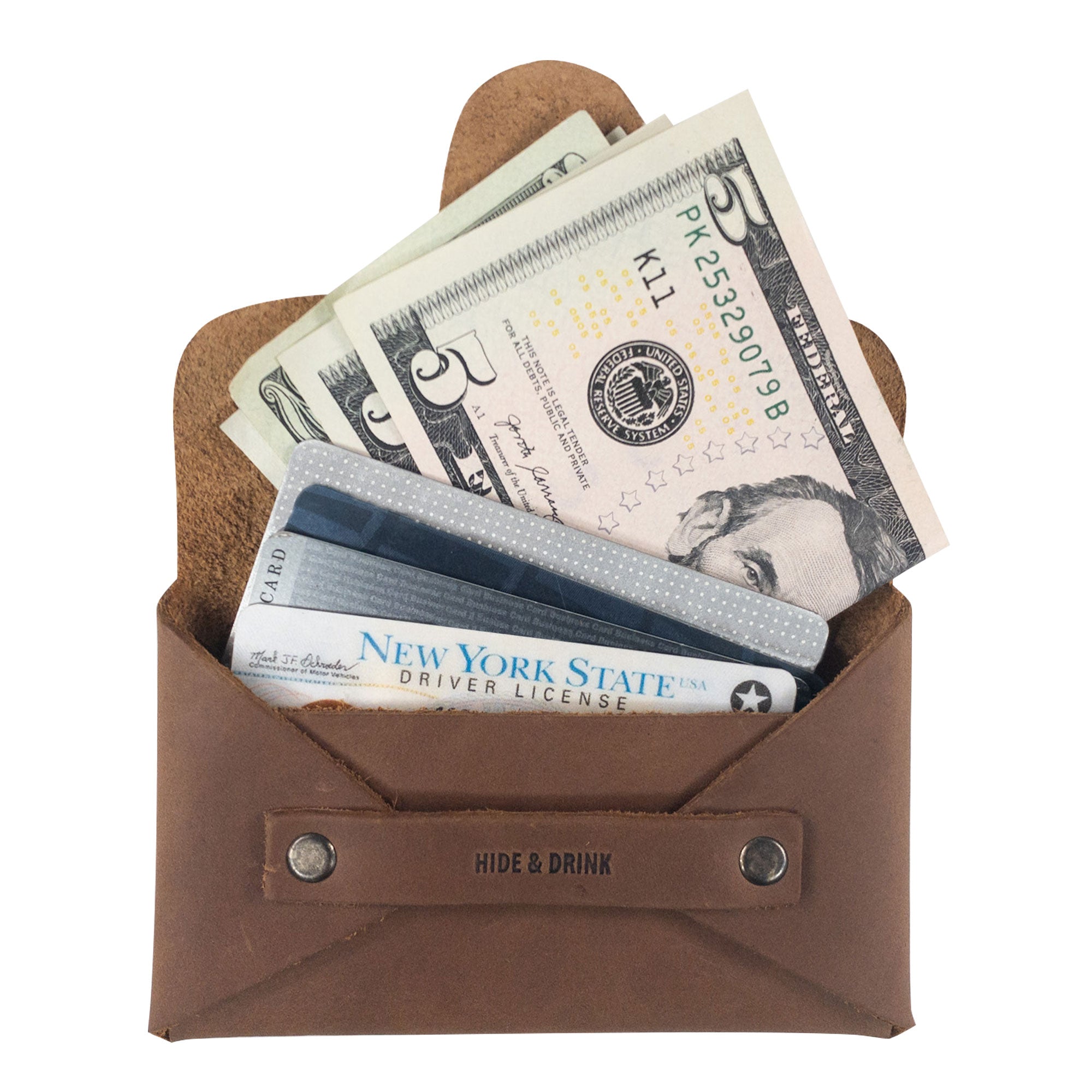 Hide & Drink's Snapless Business Card Holder is a stylish and functional vintage wallet made of Full Grain Leather, perfect for both men and women. This sturdy pouch doubles as a money organizer and is handcrafted in La Antigua Guatemala & Oaxaca Mexico, reflecting small batch production with artisan craftsmanship. Ideal for anyone looking to simplify their wallet needs.