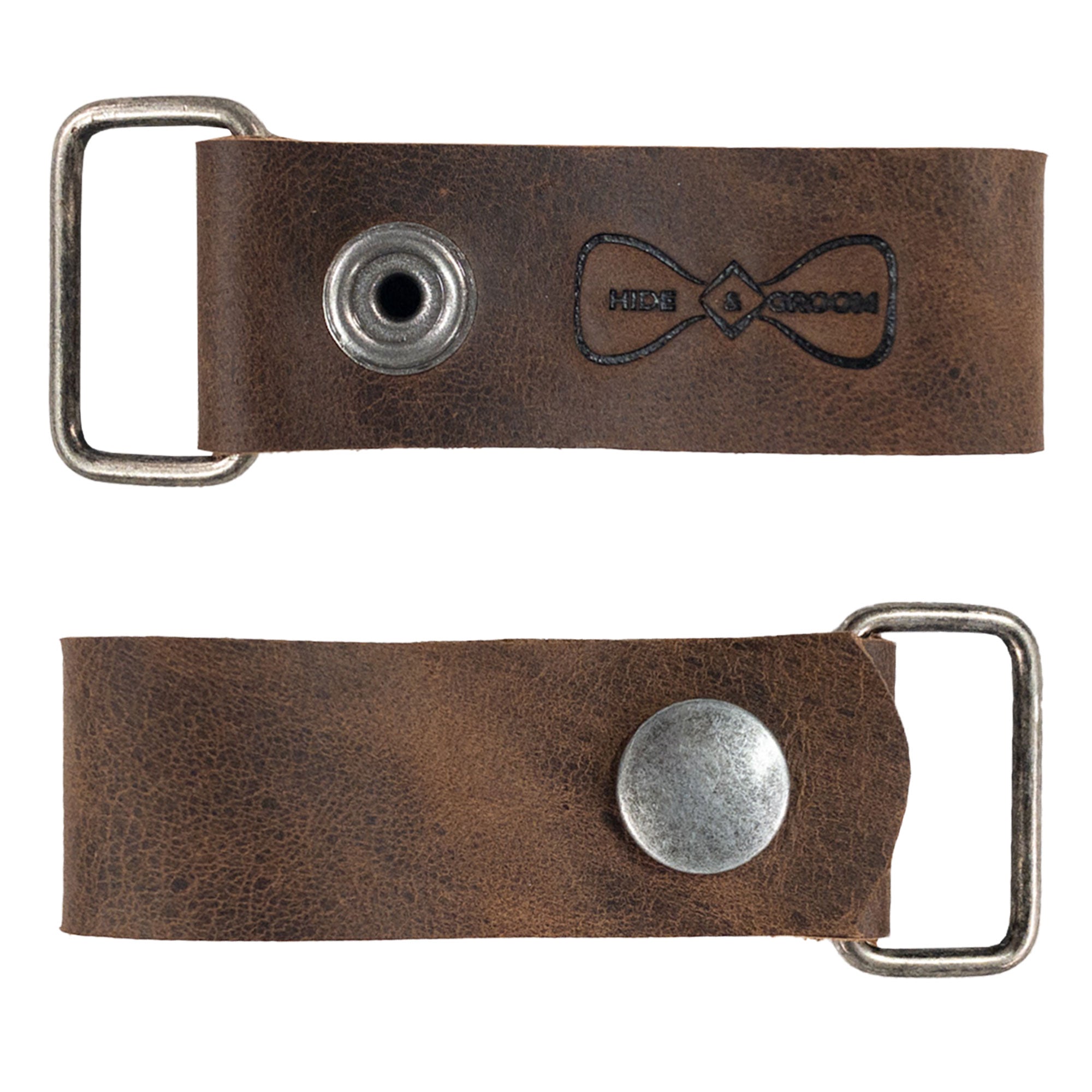 A flat lay image of the Set of 2 Suspender Loop Attachments with Snap Closure by Hide & Groom, showcasing its craftsmanship and heavy-duty features. Set of 2 Suspender Loops Attachment for Men with Snap Closure, Heavy Duty, Wedding Accessories, Full Grain Leather, StockyardX, Small Batch Production, Hand Cut, Hand Sewn, Fire Branded, Artisan, Handmade in La Antigua Guatemala & Oaxaca Mexico.