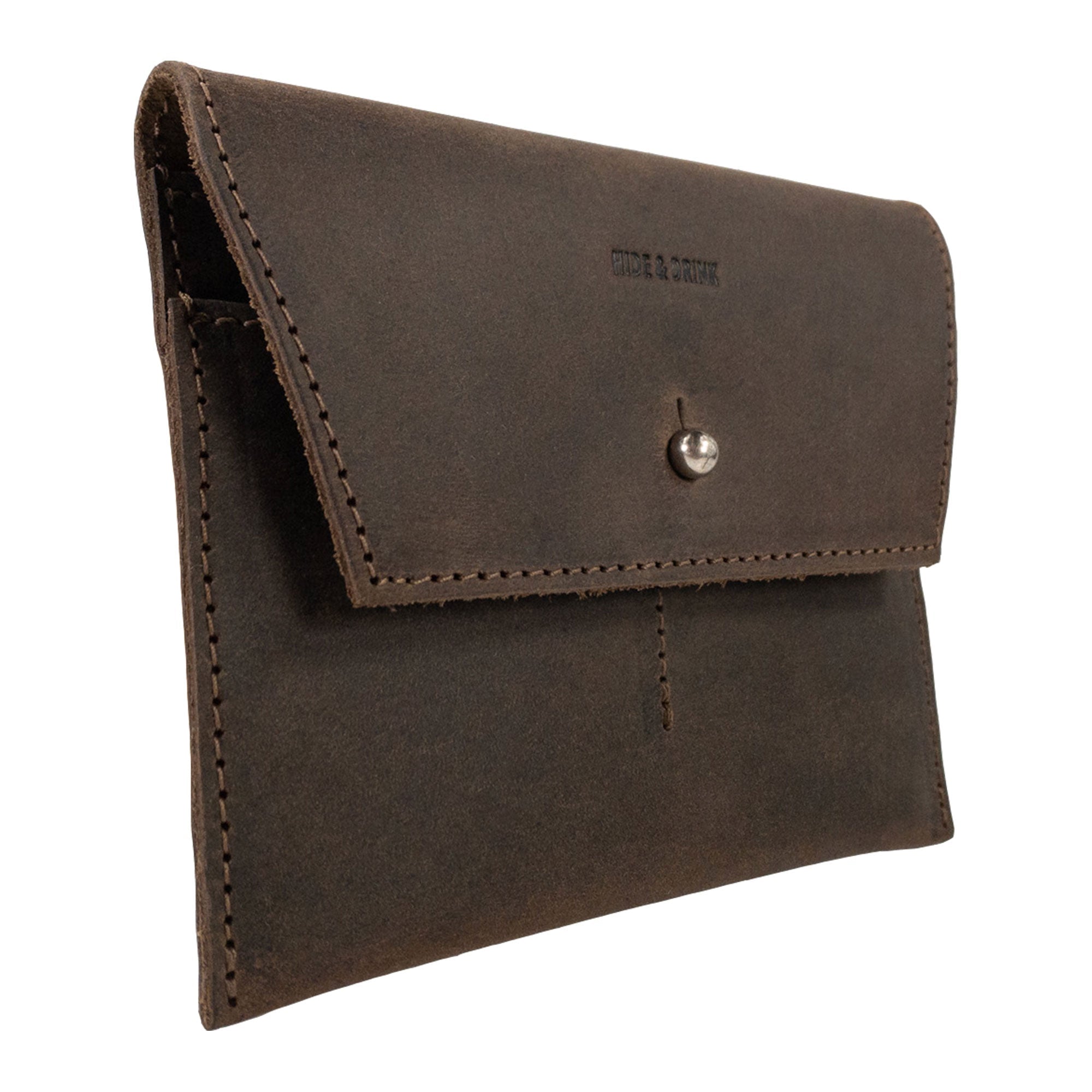 Side profile of Hide & Drink Minimalist Wallet showcasing its elegant design and secure snap closure. This durable cash organizer, made from attractive full grain leather, represents the quality artistry of handmade goods from La Antigua Guatemala & Oaxaca Mexico.