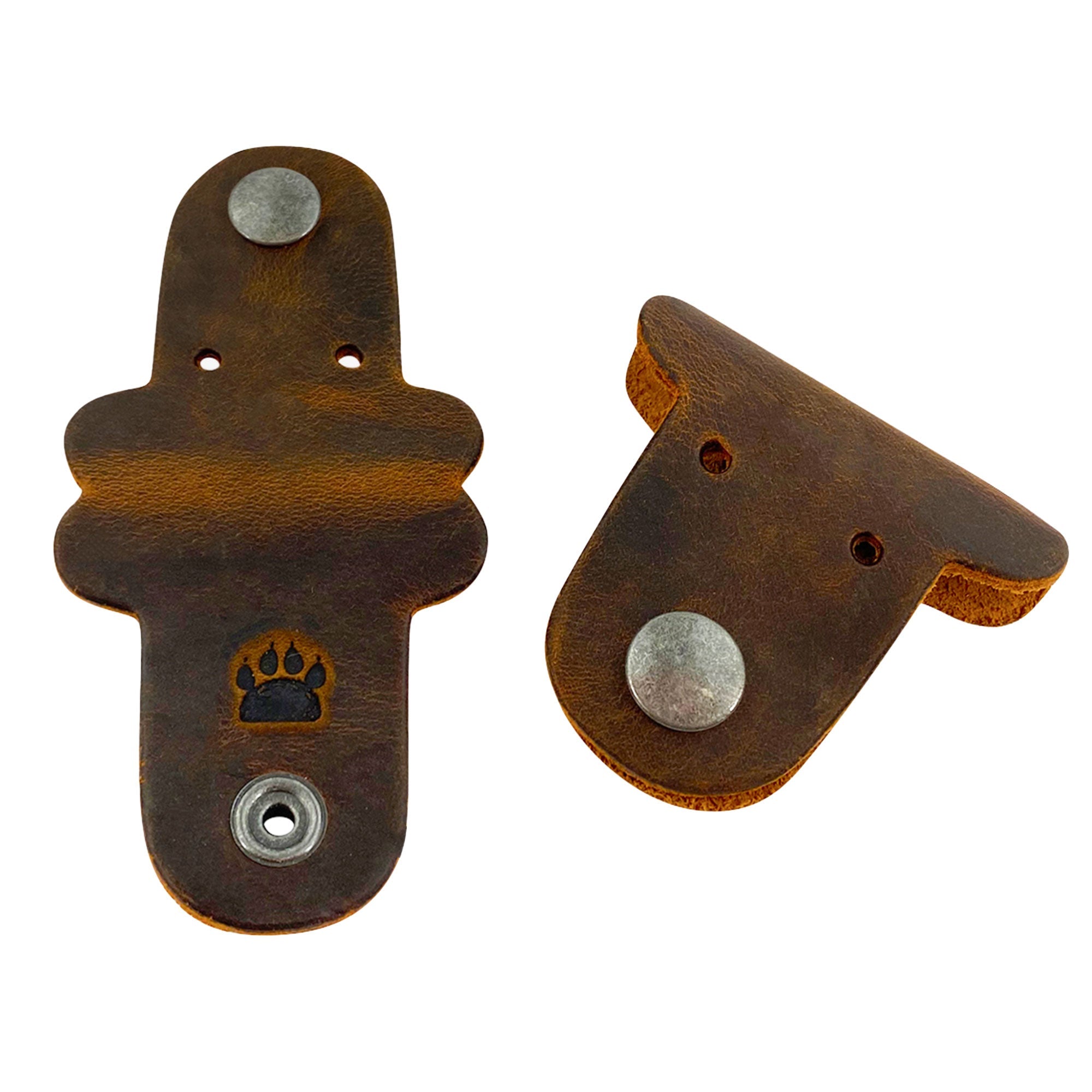 Taco Dog's Dog Cord Keeper offers a stylish solution for organizing your cables and chargers. Made of full grain leather, these handmade cord management accessories are perfect for traveling. Enjoy small batch artisan quality from La Antigua Guatemala with each charming piece in this 2 pack.