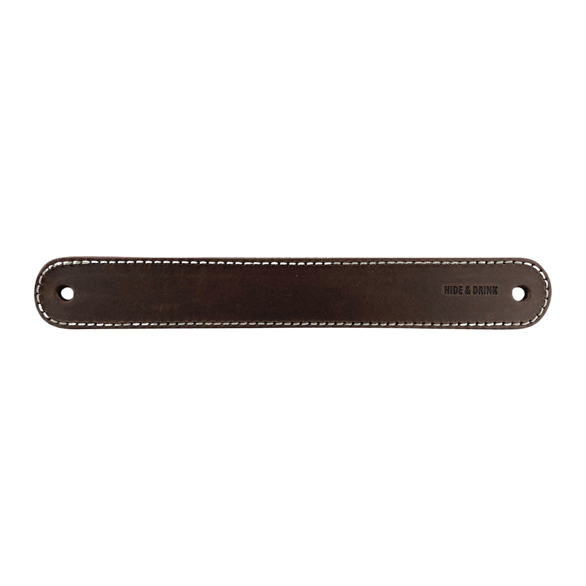 Hide & Drink Drawer Handles (4pk) displaying a leather handle with clean stitching, showcasing its durability and artisan craftsmanship. A stylish home accessory that's easy to install with pre-made holes.