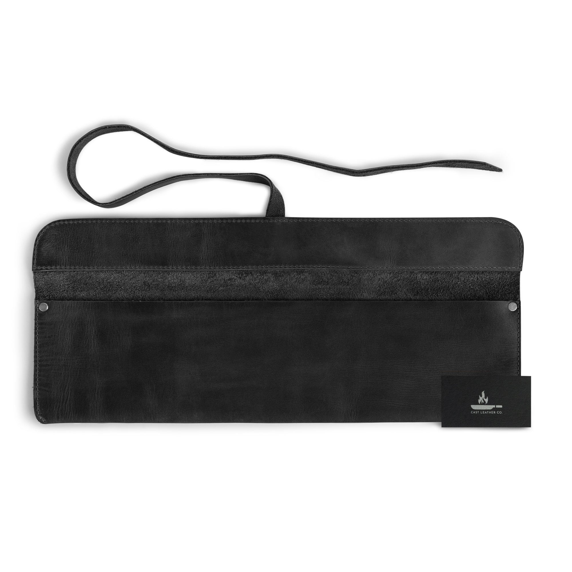 Cast Leather Co. Single Leather Knife Case in black, paired with a business card for brand presentation. This stylish yet functional kitchen small storage bag is an ideal solution for chefs on the go. Made from high-quality full grain leather in La Antigua Guatemala, it reflects the artistry of handmade craftsmanship.