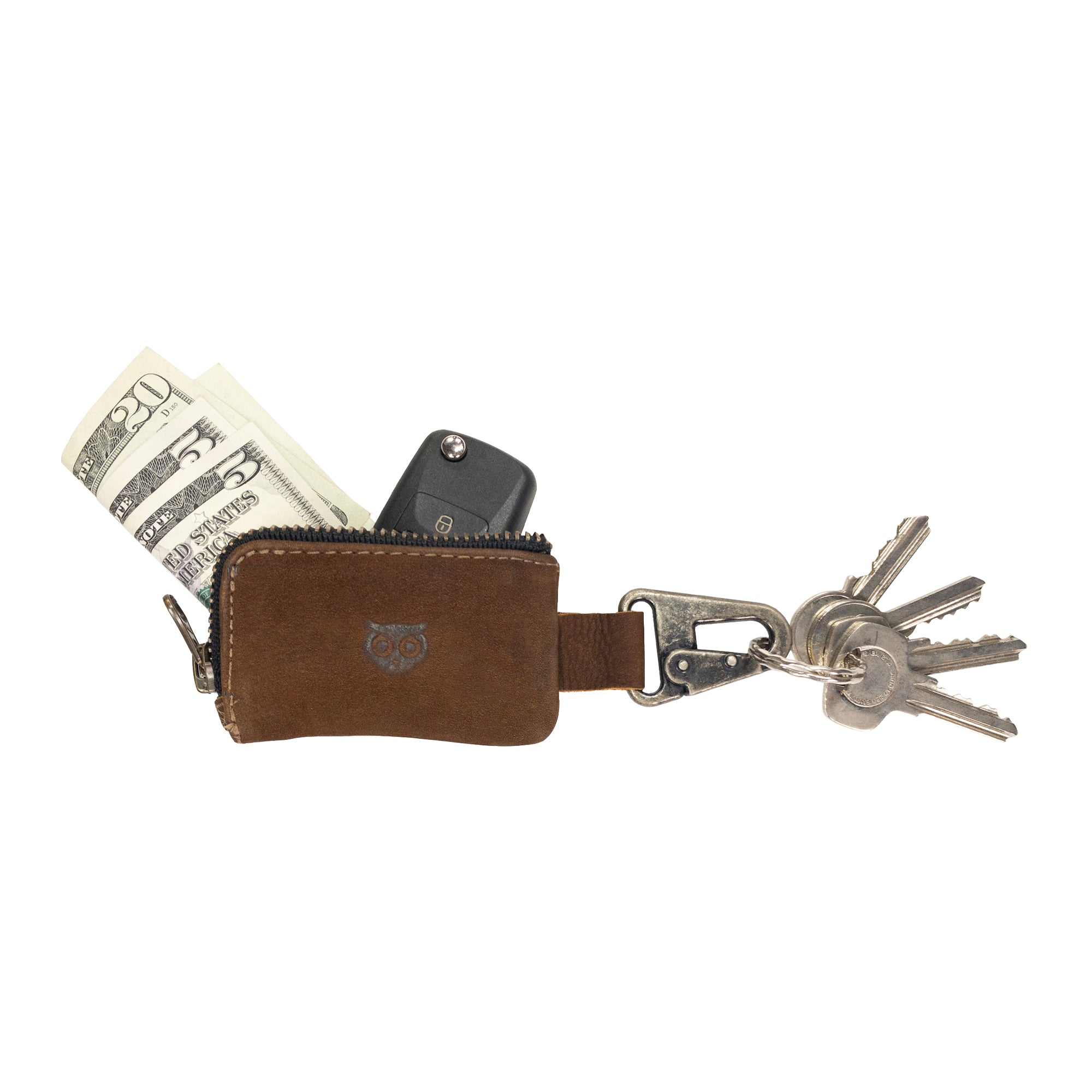 The Car Key Holder from Hide & Drink displays cash and a car key elegantly stored within its rustic leather casing. This versatile Car Key Holder features a zipper case with a nickel metal clasp, suitable for organizing headphone and charging cables, memory cards, and flash drives. Experience top-notch craftsmanship through small batch production, hand cut and hand sewn details, handmade in La Antigua Guatemala & Oaxaca Mexico.