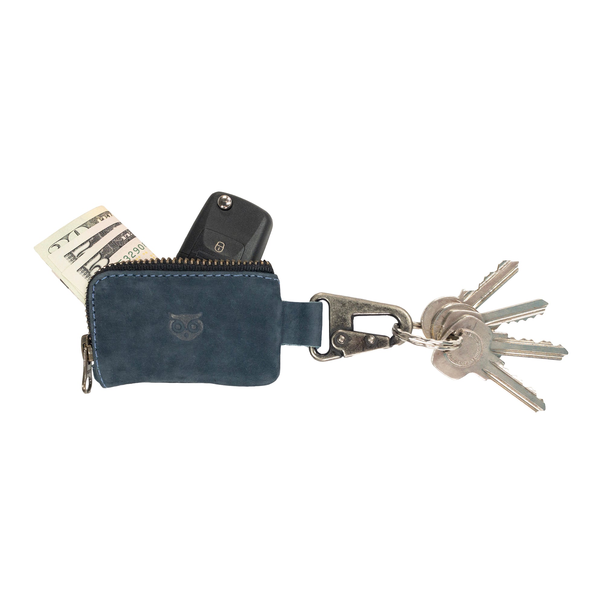 A detailed shot of the Hide & Drink Car Key Holder with keys attached, showcasing its full grain leather and sturdy construction for holding cash and accessories like headphone cables and flash drives. Artisan made in La Antigua Guatemala & Oaxaca Mexico.