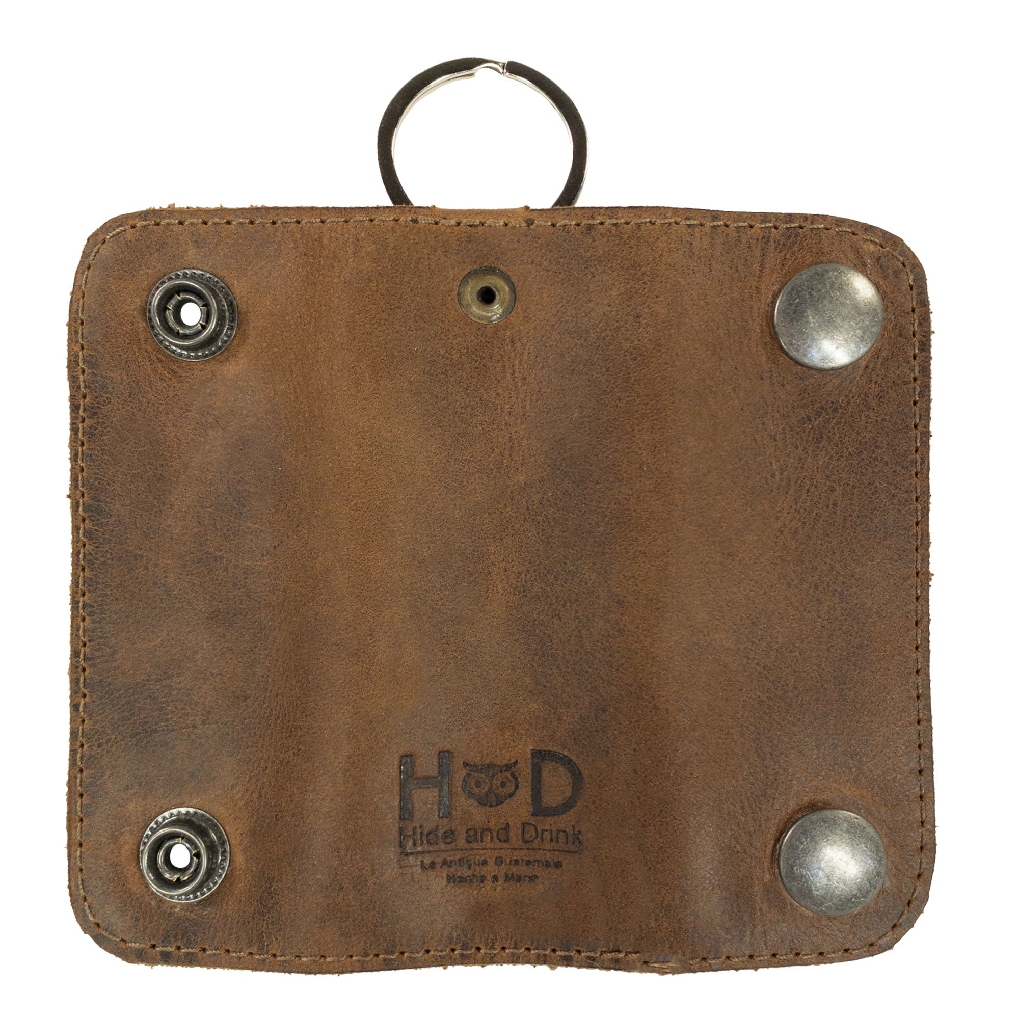 The back of the Double Snap Key Holder by Hide & Drink features an intricate stitching and quality metal snaps, made from Full Grain Leather. This handmade accessory exemplifies the essence of small batch production and artisan craftsmanship from La Antigua Guatemala & Oaxaca Mexico.