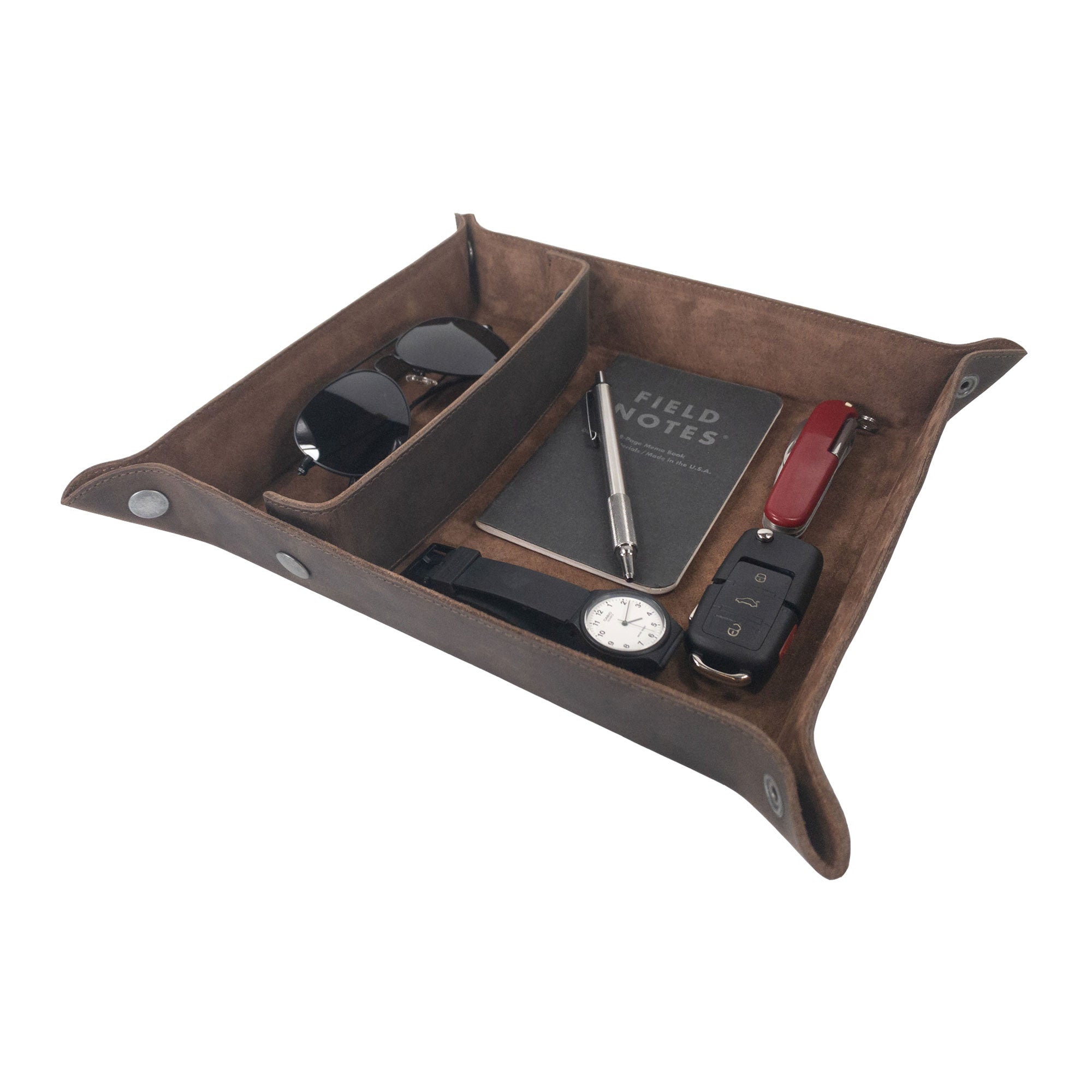 An image showing the Rectangular Catchall with Removable Compartment from Hide & Drink, featuring its elegant design with organizational space for essential items such as a watch, keys, and notes. This desktop storage item is crafted with Full Grain Leather & Sheepskin, embodying Small Batch Production, Hand Cut, Hand Sewn, and Fire Branded techniques, from artisans in La Antigua Guatemala & Oaxaca Mexico.