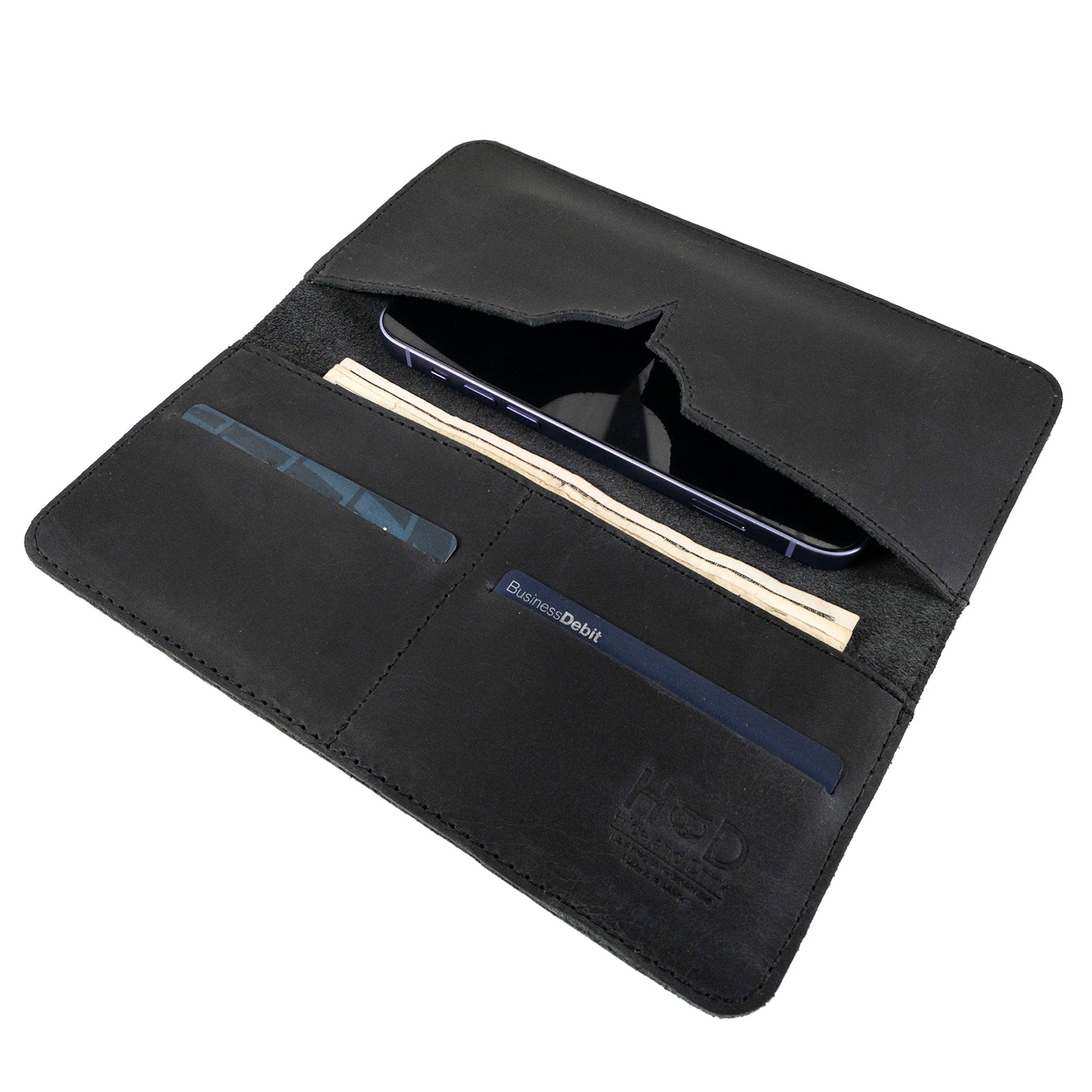 Exterior view of the closed black bifold wallet for cellphone by Hide & Drink, emphasizing its sleek design. This Bifold Wallet for Cellphone combines functionality with style, crafted from high-quality Full Grain Leather. Experience the unique artisan touch from small batch production in La Antigua Guatemala & Oaxaca Mexico.