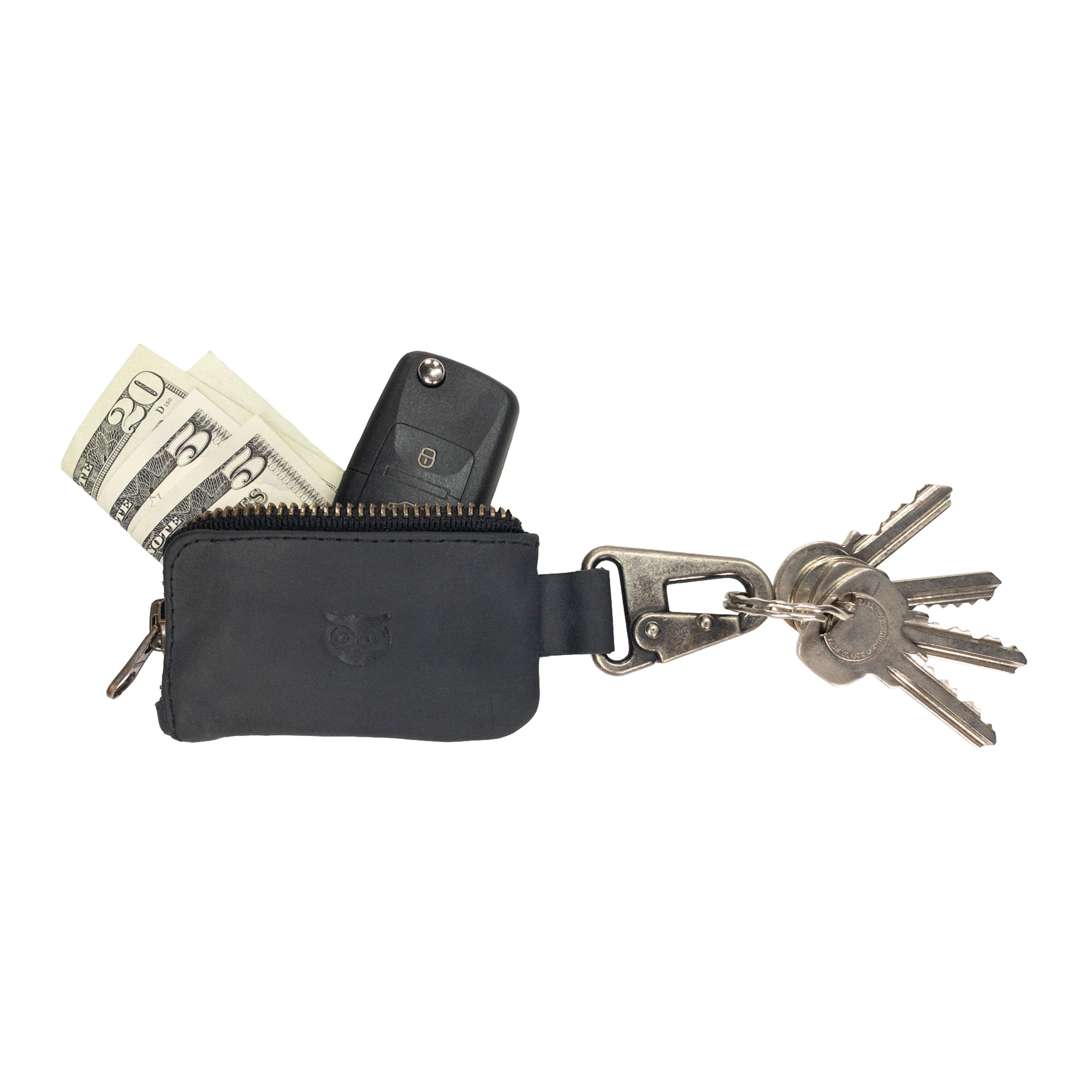 The Car Key Holder by Hide & Drink neatly displays cash and keys, exemplifying its rustic leather appeal. This practical Car Key Holder serves as a cash zipper case for headphone and charging cables, memory cards, and flash drives, featuring a robust nickel metal clasp for security. With a focus on artisan quality, it is created through small batch production and hand cut, hand sewn methods, handmade in La Antigua Guatemala & Oaxaca Mexico.