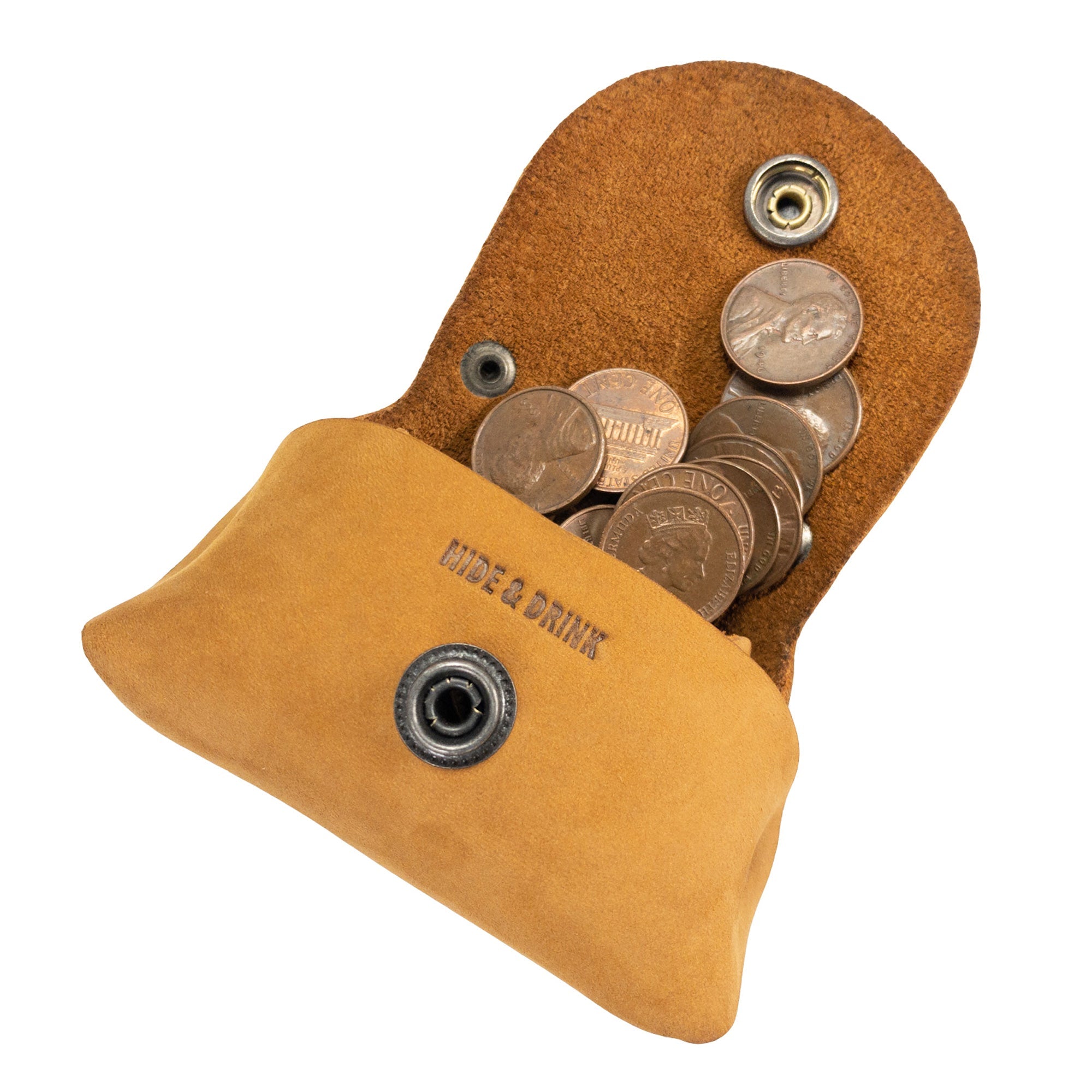 Inside view of the mustard Tiny Handbag Keychain by Hide & Drink, featuring coins and showcasing the Tiny Handbag with Key Ring Holder made from Full Grain Leather. This artisan product is part of Small Batch Production, Hand Cut, Hand Sewn, and Fire Branded, reflecting its Handmade quality from La Antigua Guatemala & Oaxaca Mexico.