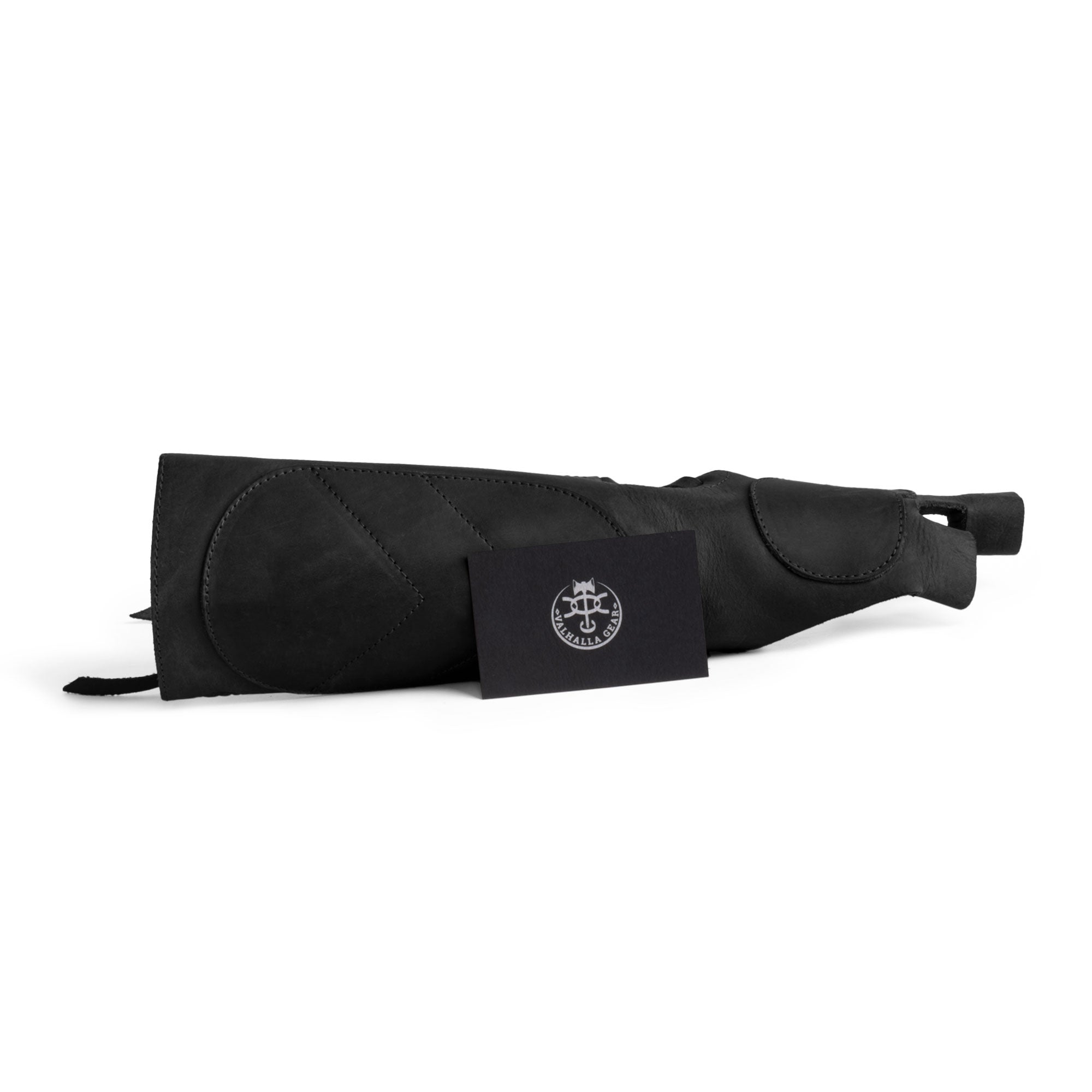 The black Forearm Guard for Archers by Valhalla Gear displayed with a branding card, emphasizing its artisan craftsmanship. This durable protective bracer is hand cut and sewn in La Antigua Guatemala, making it perfect for archers seeking full grain leather arm protection.