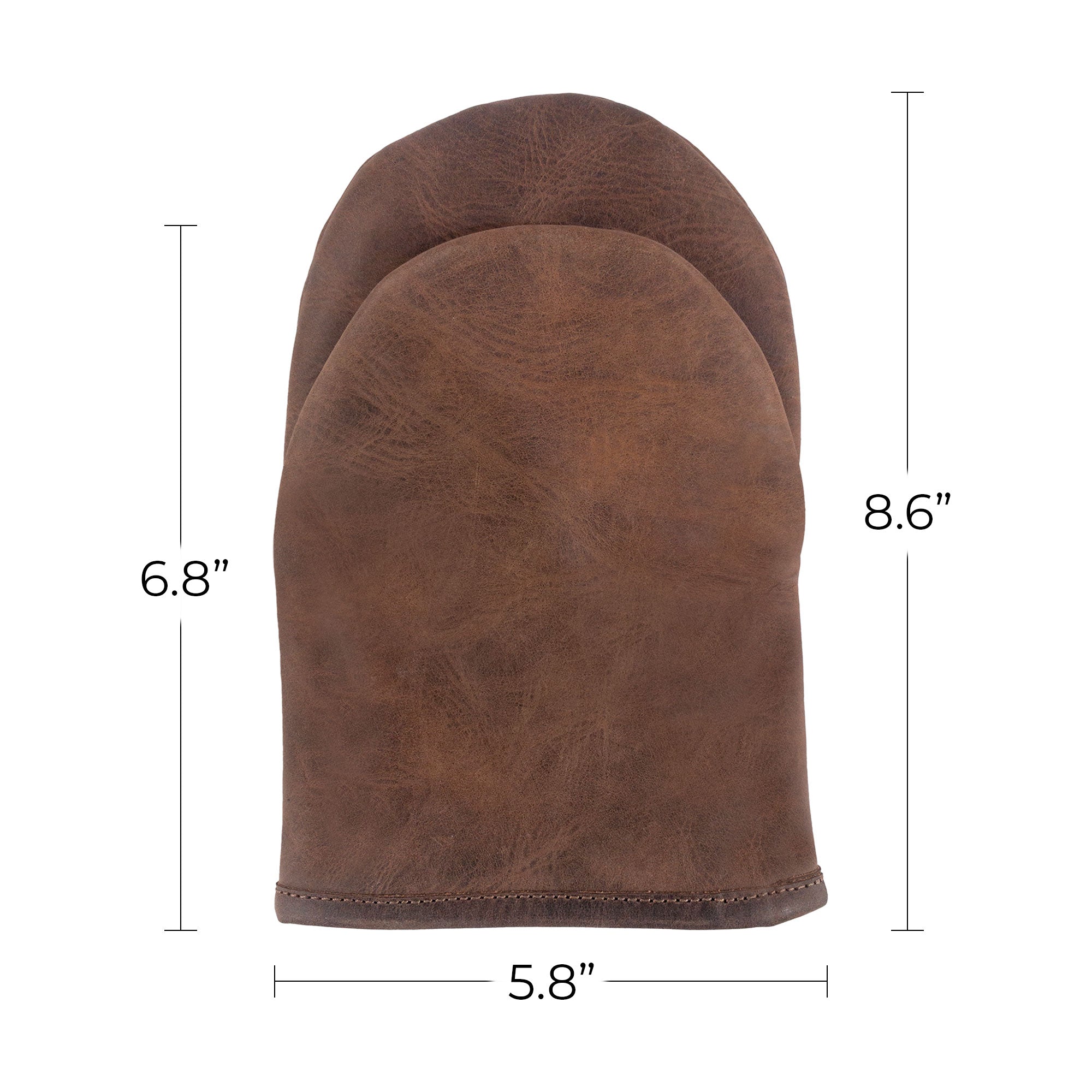Detailed view of the Cast Leather Co. Dual-Hand Leather Oven Mitt alongside product tags, emphasizing its artisan quality and craftsmanship. This heat-resistant oven glove made from Full Grain Leather is a must-have for any kitchen, proudly handmade in La Antigua Guatemala & Oaxaca Mexico.