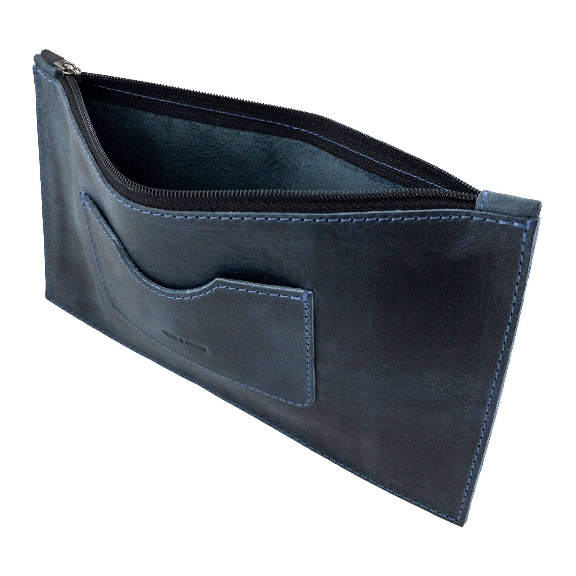 An interior view of a dark brown rectangular zippered handbag by Hide & Drink, featuring a spacious design and a card slot. This stylish female purse is made from durable full grain leather, reflecting artisan mastery and small batch production techniques, handcrafted in La Antigua Guatemala & Oaxaca Mexico.