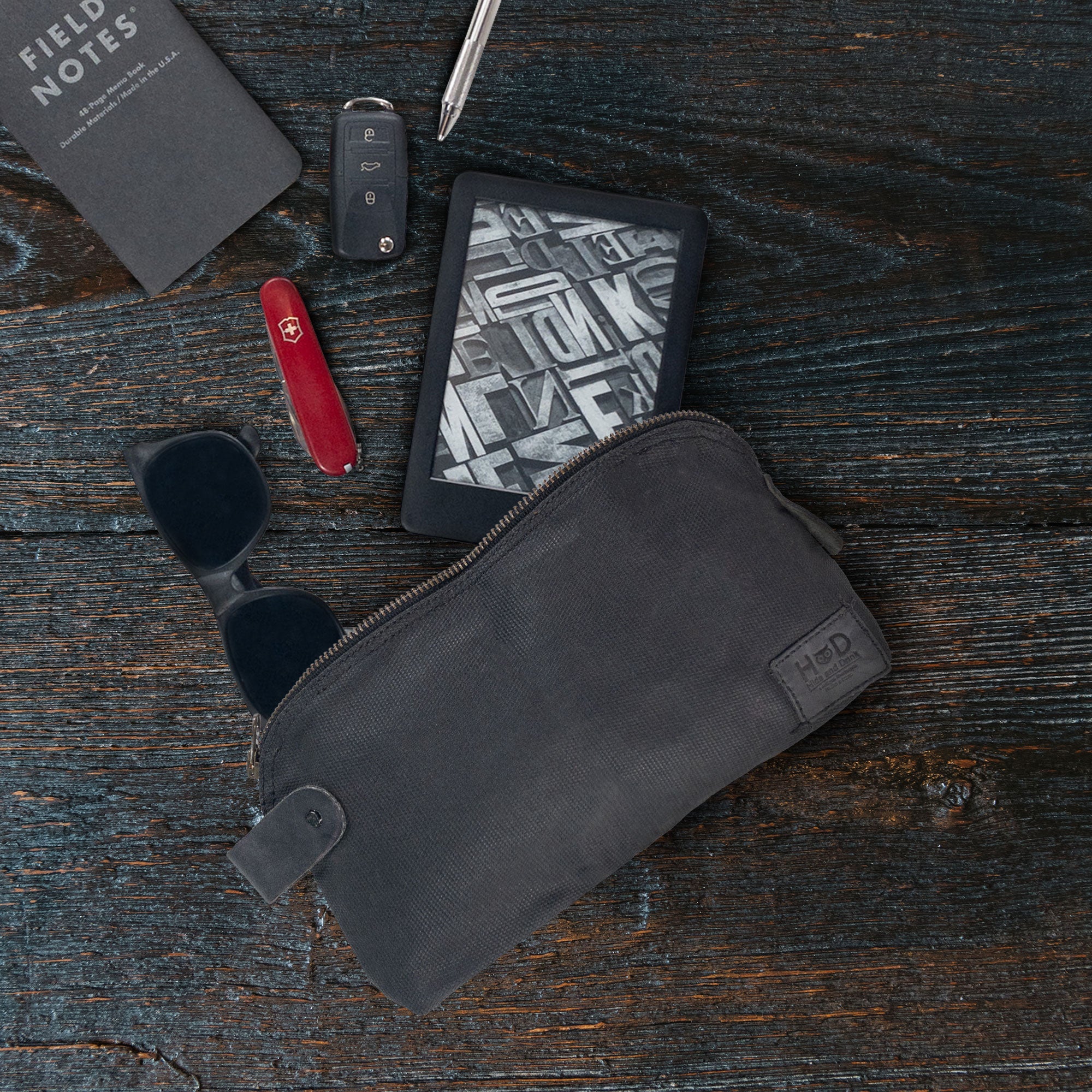 Dopp Kit Utility Bag by Hide & Drink illustrating its dynamic use-case scenarios for modern adventurers. This large rustic all-purpose Dopp Kit Utility Bag is crafted from full grain leather showcasing artisan quality craftsmanship through hand cut and hand sewn methods, handmade in La Antigua Guatemala & Oaxaca Mexico.