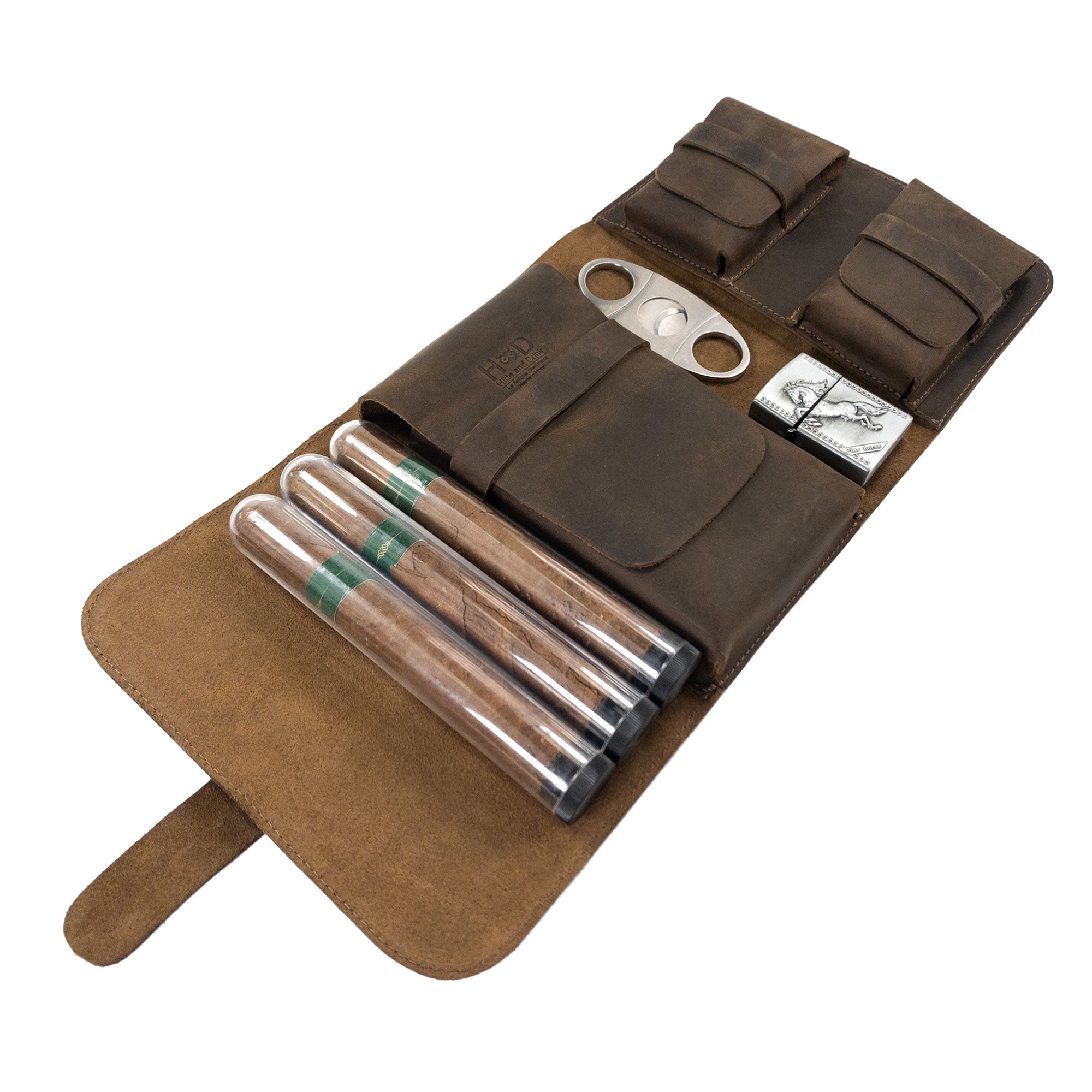 Triple Cigar Case by Hide & Drink, arranged with cigars, cutter, and lighter in its rustic design. This full grain leather accessory is handmade, highlighting small batch production and artisan quality from La Antigua Guatemala.