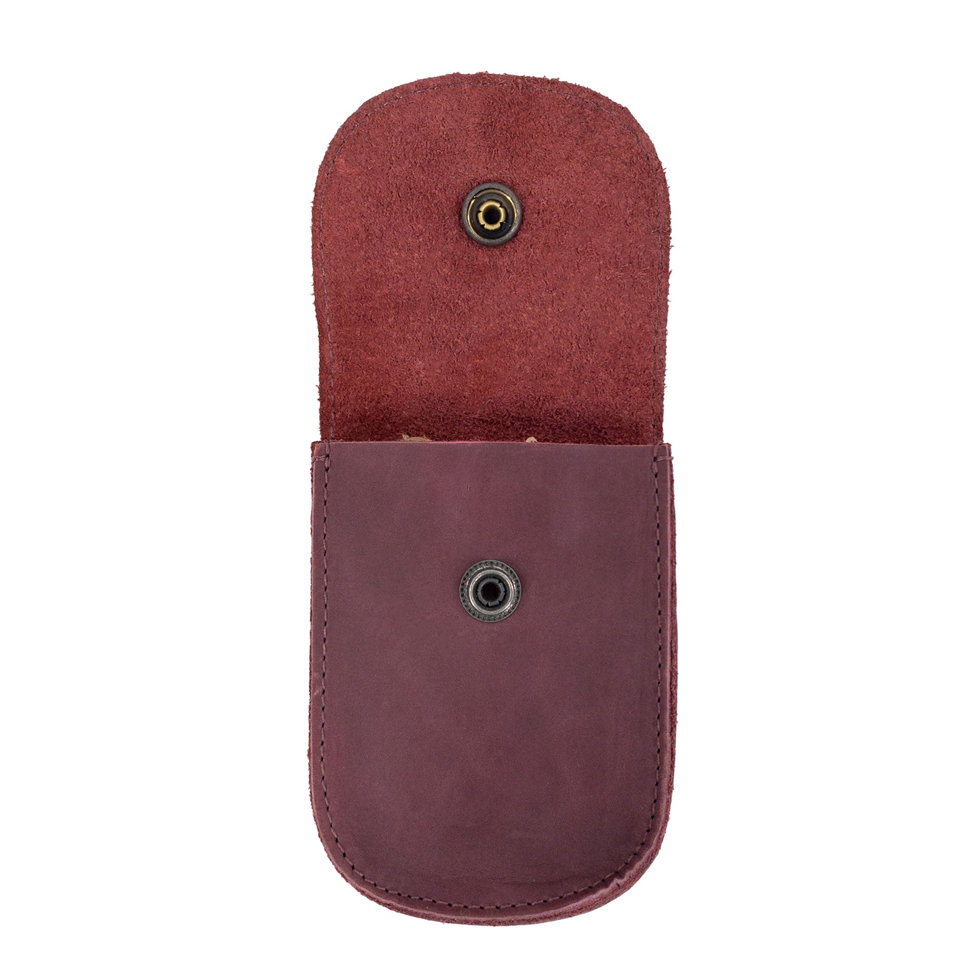 Holster Pouch by Hide & Drink displayed with brand materials, showcasing its quality craftsmanship and stylish appearance. This durable pouch made of full grain leather is ideal for everyday use.