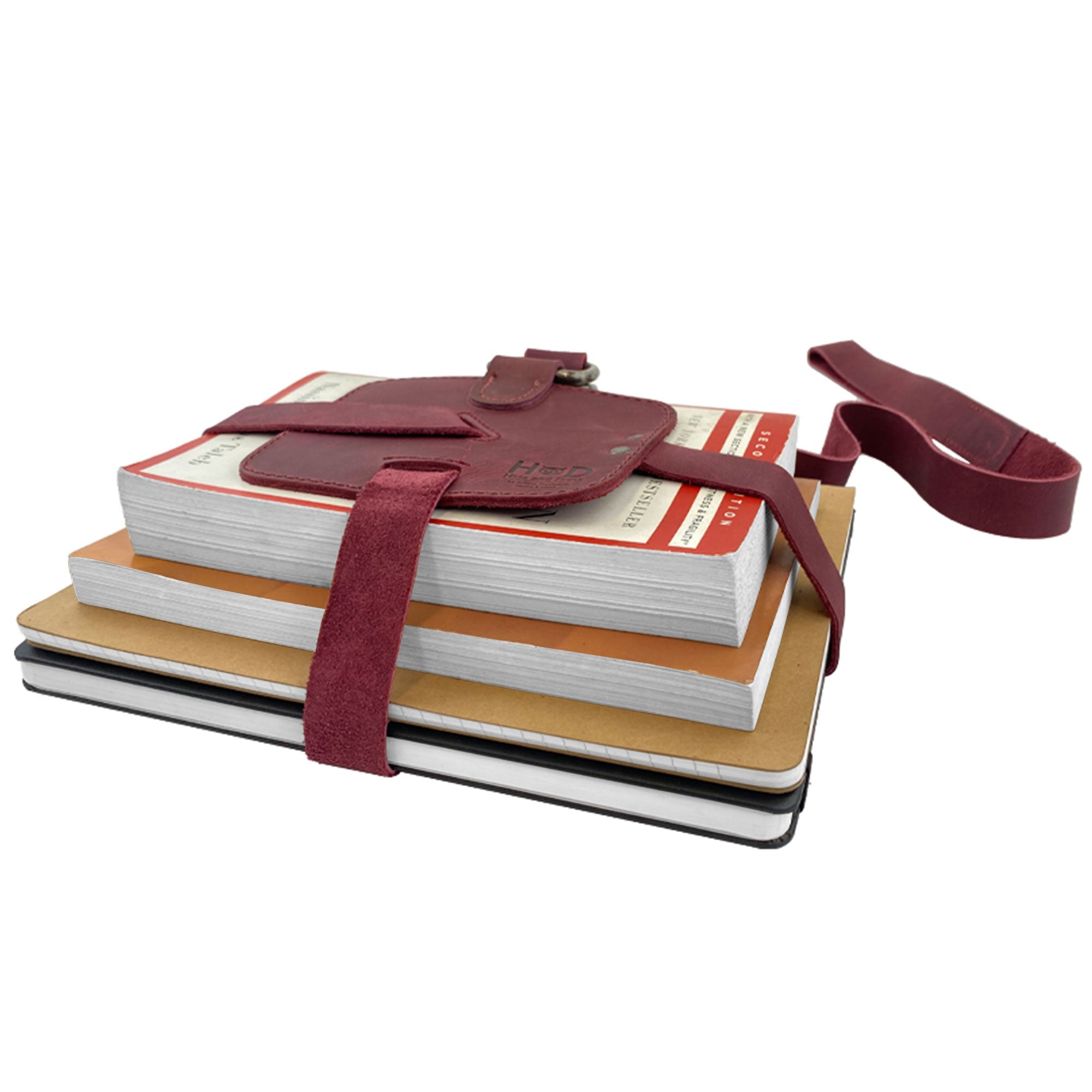Close-up detail of the Hide & Drink Book Strap Carrier, emphasizing its stylish stitching and leather quality. This Full Grain Leather accessory is made by artisans in La Antigua Guatemala, designed for those who appreciate craftsmanship.