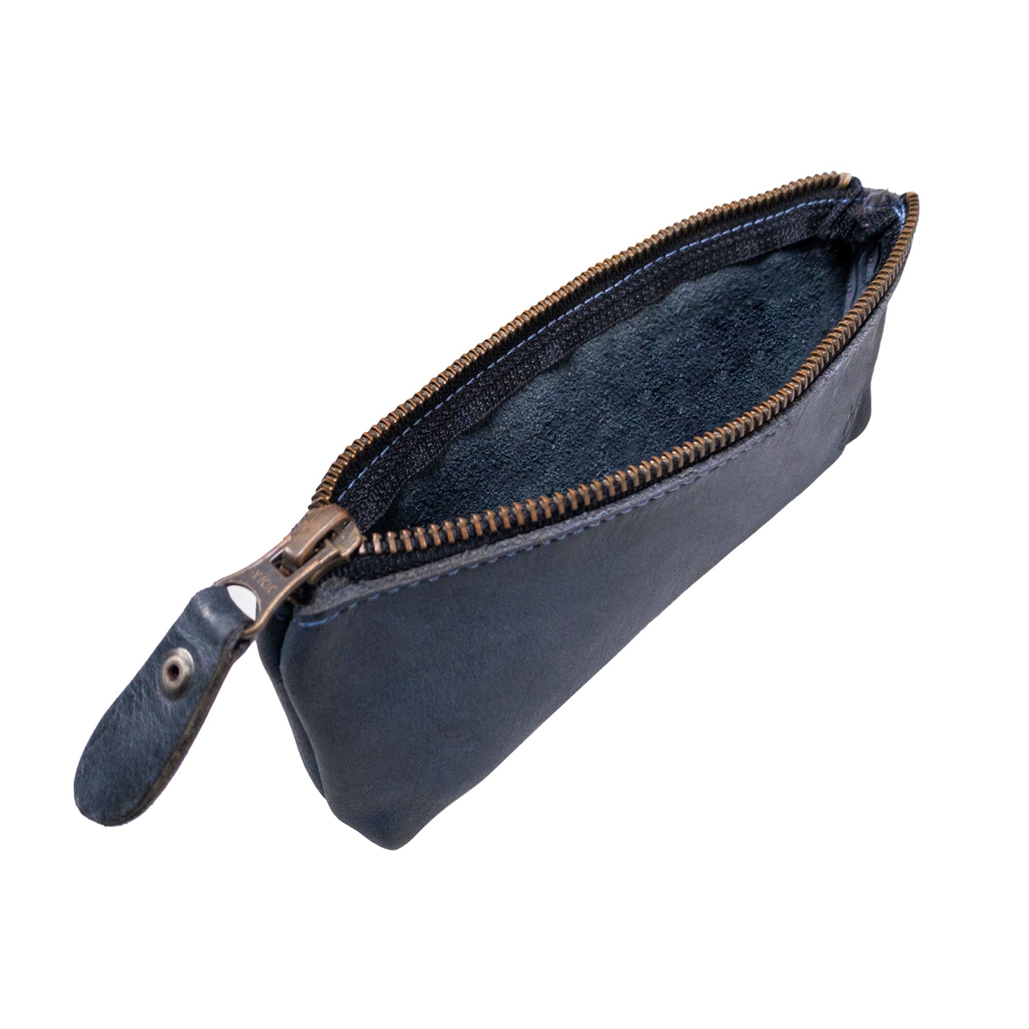 Open view of Hide & Drink Pencil Pouch, revealing luxurious suede leather lining inside a beautifully constructed full grain leather exterior. This flat zippered holder serves as an excellent pen and marker pouch, embodying classic style for artists and everyday users alike. Handmade with care in La Antigua Guatemala & Oaxaca Mexico, it stands out with its artisan quality.