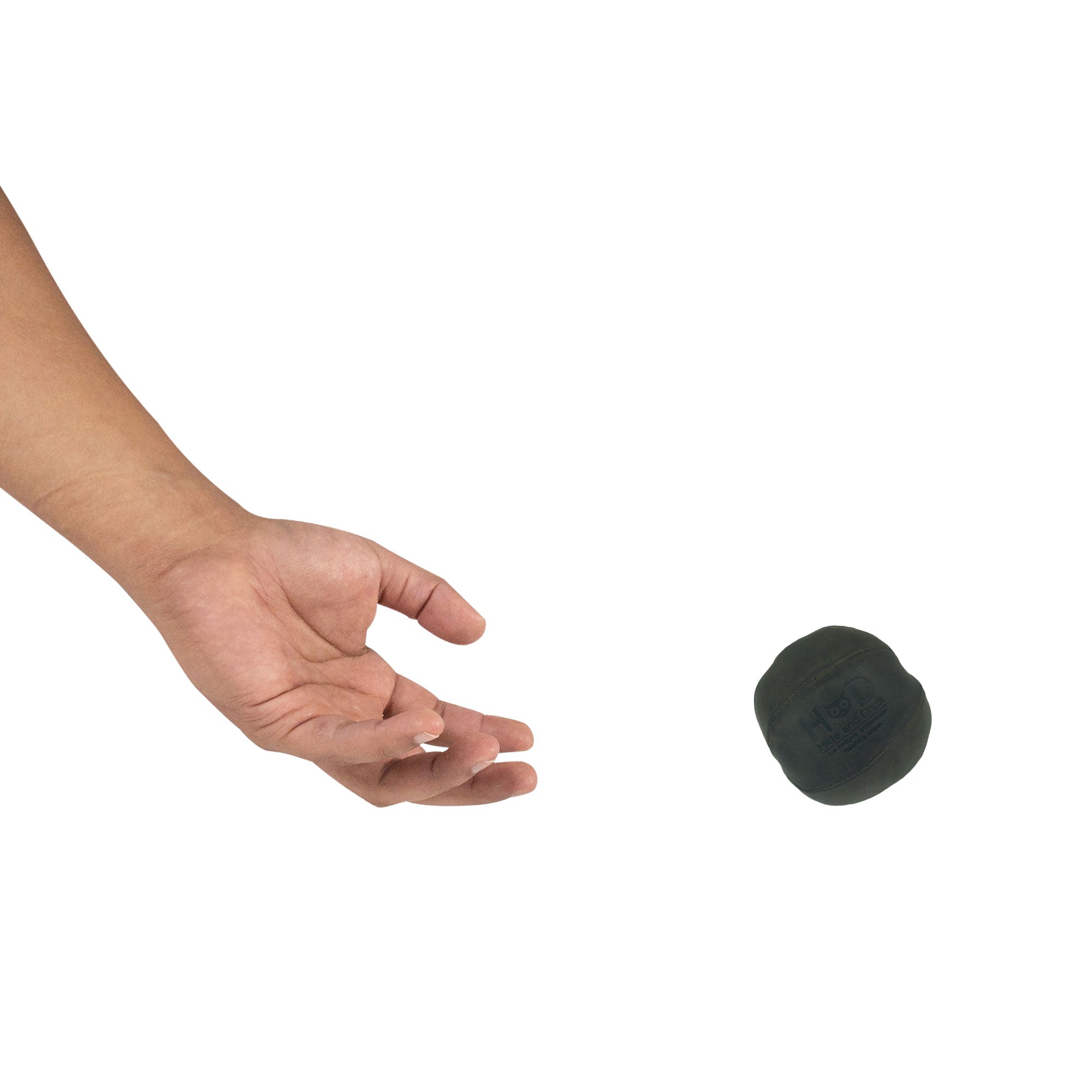 Hide & Drink green Stress Ball released into the air, expertly designed to alleviate fidgeting and anxiety. This squishy tension accessory features classic styling and is made from full grain leather, handcrafted in La Antigua Guatemala.