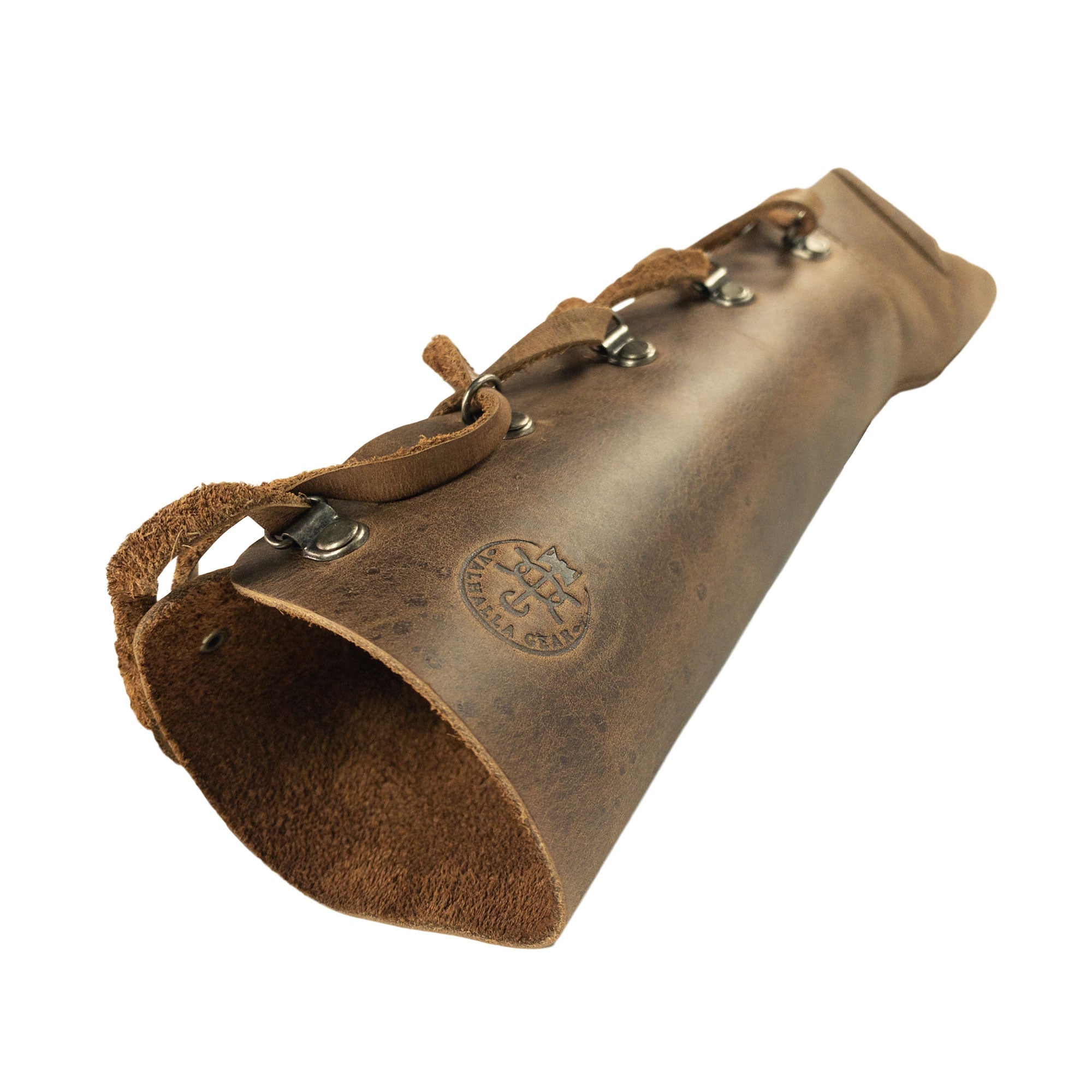 A close-up of the durable interior of the Archery Forearm Protector by Valhalla Gear, showcasing its robust construction with a fire branded logo. This arm guard, crafted from full grain leather, is perfect for bow shooting practice, training, and cosplay, symbolizing the artisan handmade spirit from La Antigua Guatemala & Oaxaca Mexico.