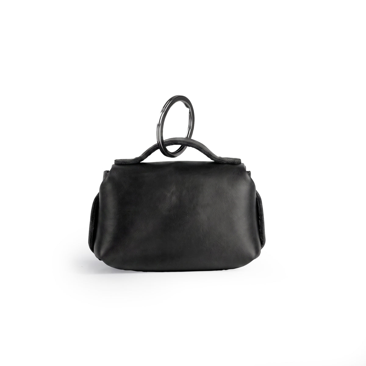 Back view of the Tiny Handbag Keychain by Hide & Drink, emphasizing its sturdy black Full Grain Leather construction and key ring. This handmade piece highlights small batch production and artisan techniques from La Antigua Guatemala.