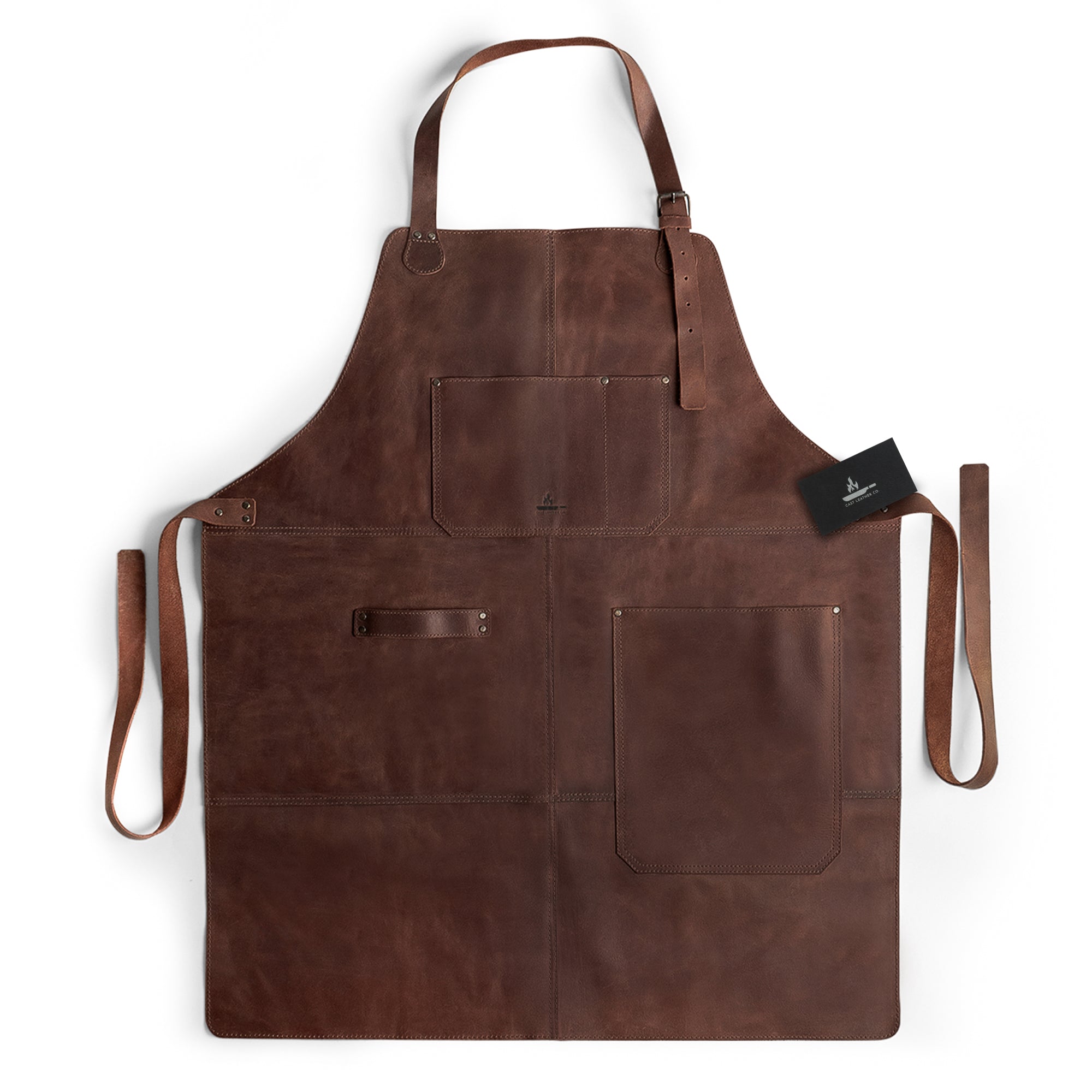 Front view of the Grill Apron by Cast Leather Co., featuring functional design elements, ideal as a Protective Clothing Cover for Cooking and Grilling. This Heat Resistant Full Grain Leather apron is perfect for any cooking enthusiast, showcasing Artisan craftsmanship. Handmade in La Antigua Guatemala & Oaxaca Mexico, it represents Small Batch Production and high-quality, Hand Sewn construction.