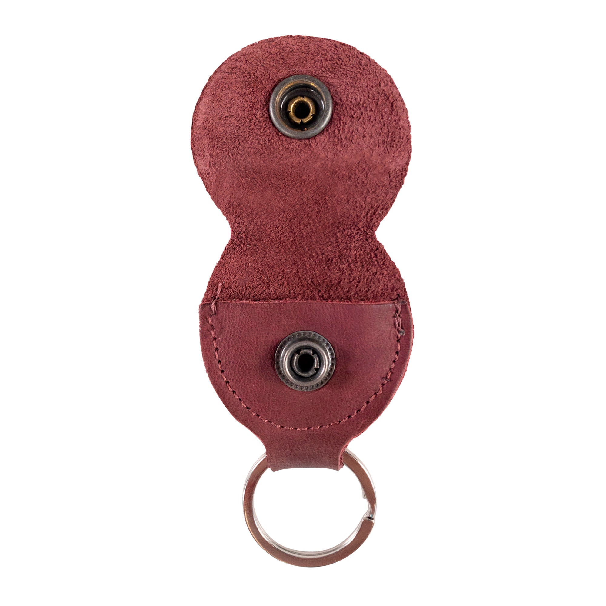 Open view of the Key Chain & Guitar Pick Holder by Hide & Drink with vibrant picks displayed. This Guitar Pick Holder with Ring is perfect for guitar players needing an effective key organizer. Crafted from Full Grain Leather, it emphasizes small batch production techniques and showcases Hand Cut and Hand Sewn details, featuring a fire branded emblem, handmade in La Antigua Guatemala & Oaxaca Mexico.