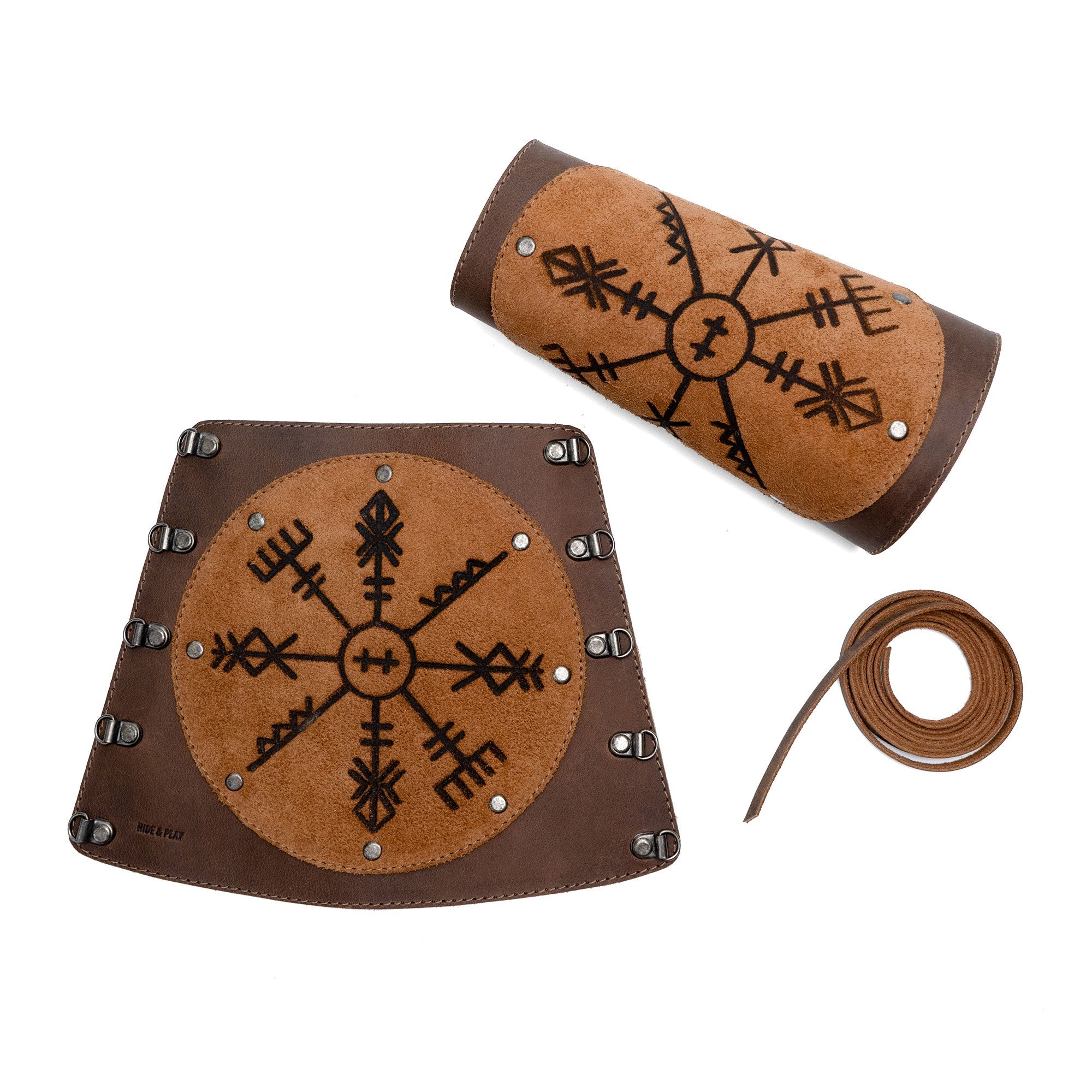 Viking Bracers by Hide & Play displayed with matching armor pieces, featuring a set of 2 Viking Style Bracers, ideal arm protectors for costume. Made from full grain leather, these items reflect artisan craftsmanship through small batch production, hand cut and hand sewn in La Antigua Guatemala & Oaxaca Mexico.