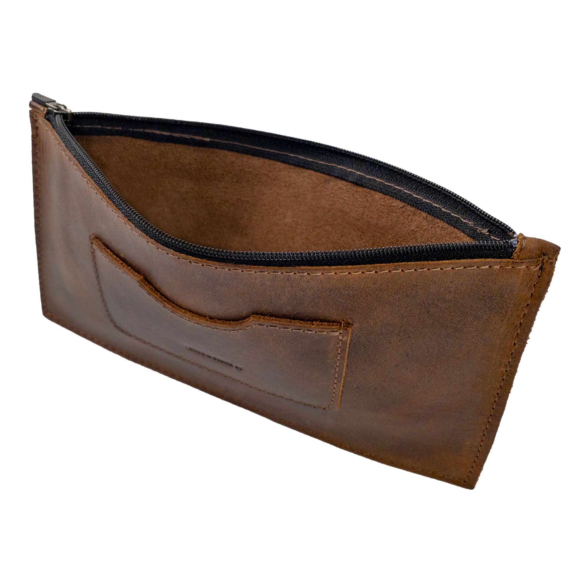 Interior view showing the zipper of a brown rectangular zippered handbag by Hide & Drink, ideal for women, revealing its card slot. This full grain leather female purse represents artisan craftsmanship through small batch production, hand cut and sewn for quality. It's a stylish addition to any outfit, handmade in La Antigua Guatemala & Oaxaca Mexico.