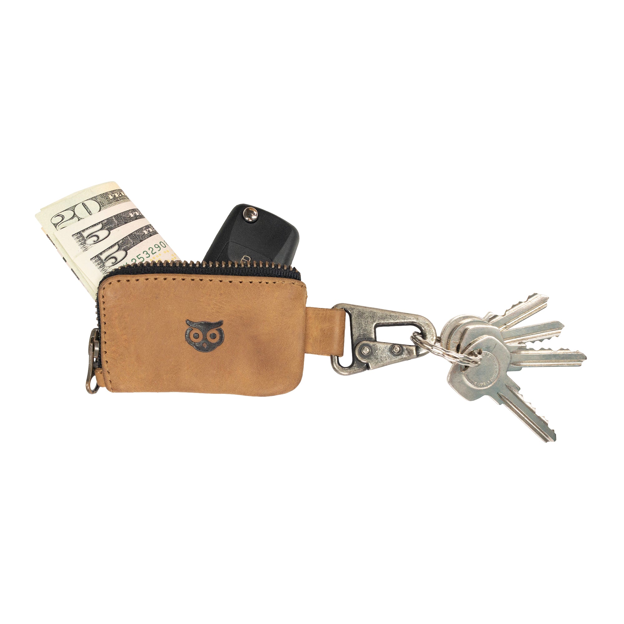Close-up of the brown Car Key Holder by Hide & Drink, highlighting its chic design for holding keys and cash, while also being a perfect fit for Headphone and charging Cables, Memory Cards, and Flash Drives. Made from premium Full Grain Leather with a Nickel Metal Clasp, showcasing artisan quality from Small Batch Production in La Antigua Guatemala & Oaxaca Mexico.