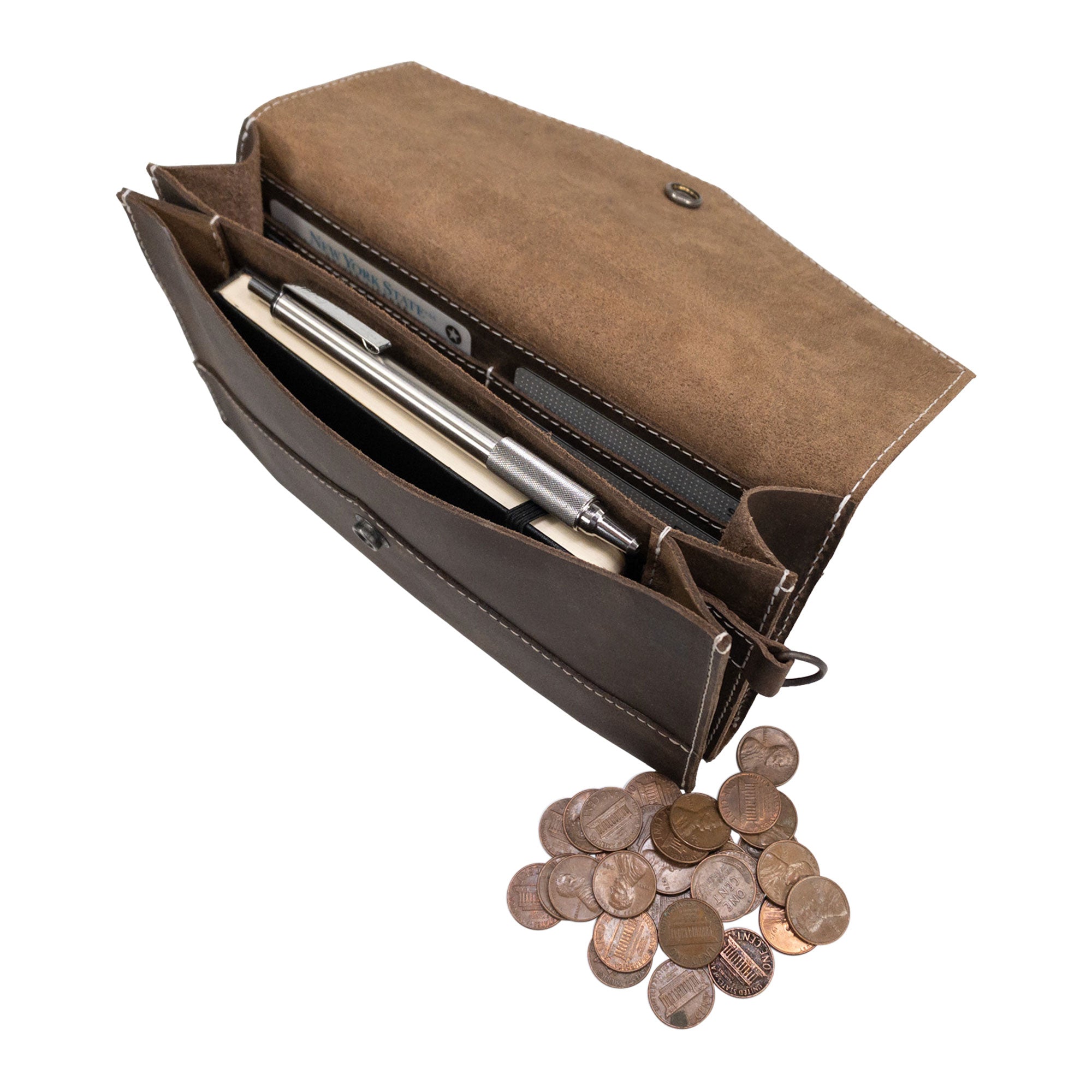 Convertible Envelope Bag by Hide & Drink displayed with coins inside for scale. Made from Full Grain Leather, this Envelope Crossbody Bag features artisan craftsmanship through small batch production, hand cut and hand sewn by skilled artisans in La Antigua Guatemala & Oaxaca Mexico.