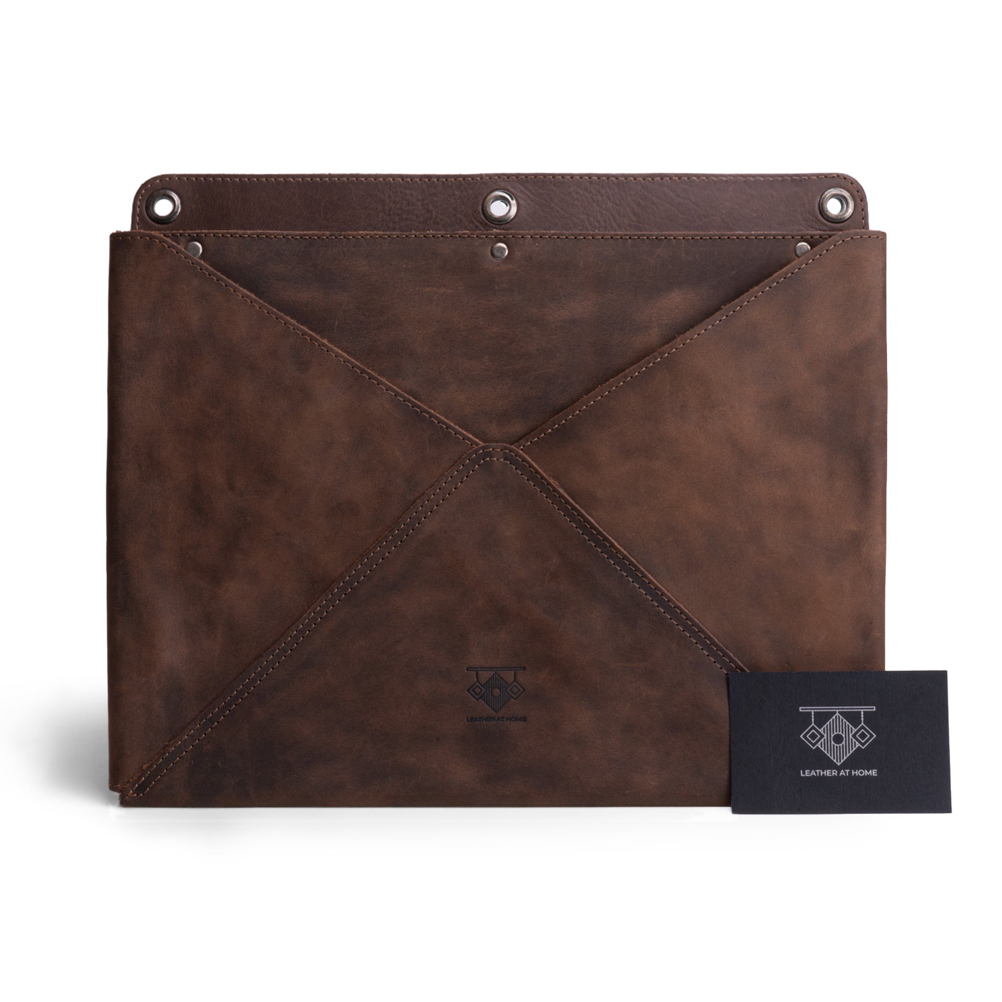Leather At Home's Wall File Organizer displayed with a business card, demonstrating its elegant design and craftsmanship. This Wall File Organizer serves as a Leather Wall Organizer for Office and a Stylish Leather Folder for Wall, making it a multifunctional piece. Handmade in La Antigua Guatemala & Oaxaca Mexico.
