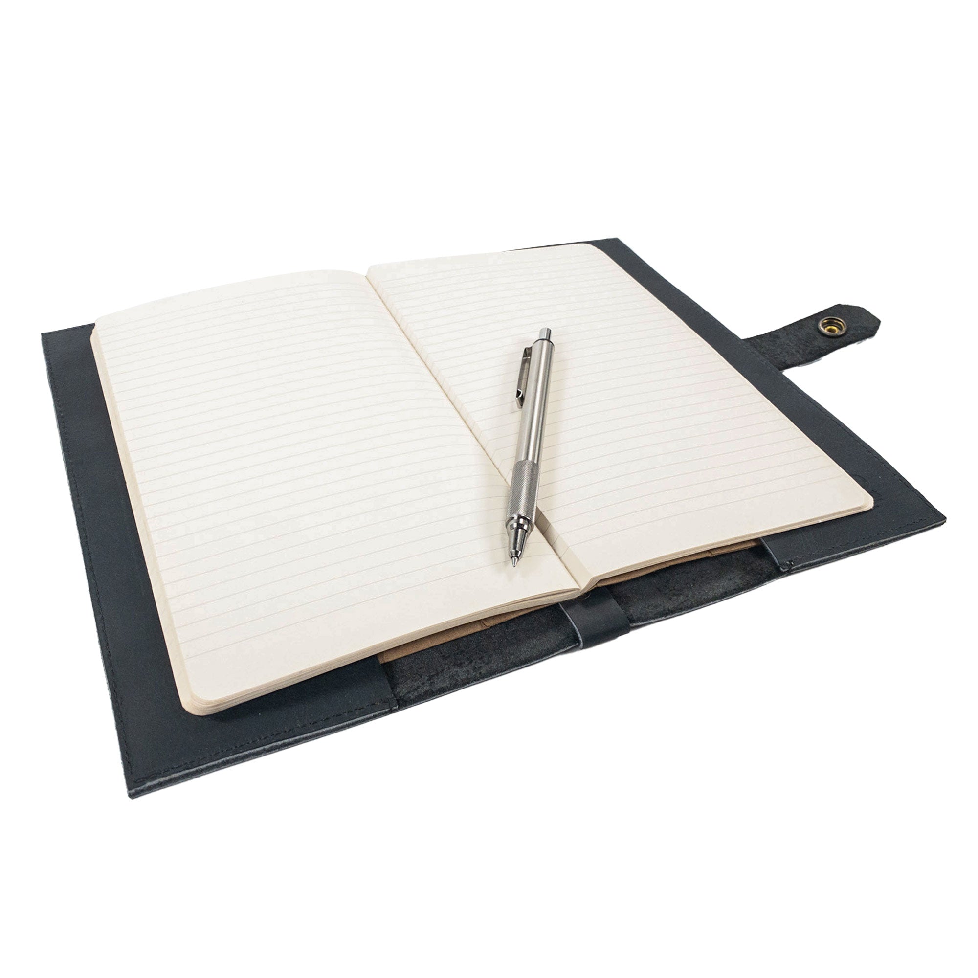 Hide & Drink's Riveted Field Note Cover for Moleskine (5 x 8.25 in.) Notebook NOT Included presented alongside a pen, showcasing its practicality and elegant appeal. Crafted from full grain leather, this cover epitomizes handmade excellence from La Antigua Guatemala & Oaxaca, Mexico.