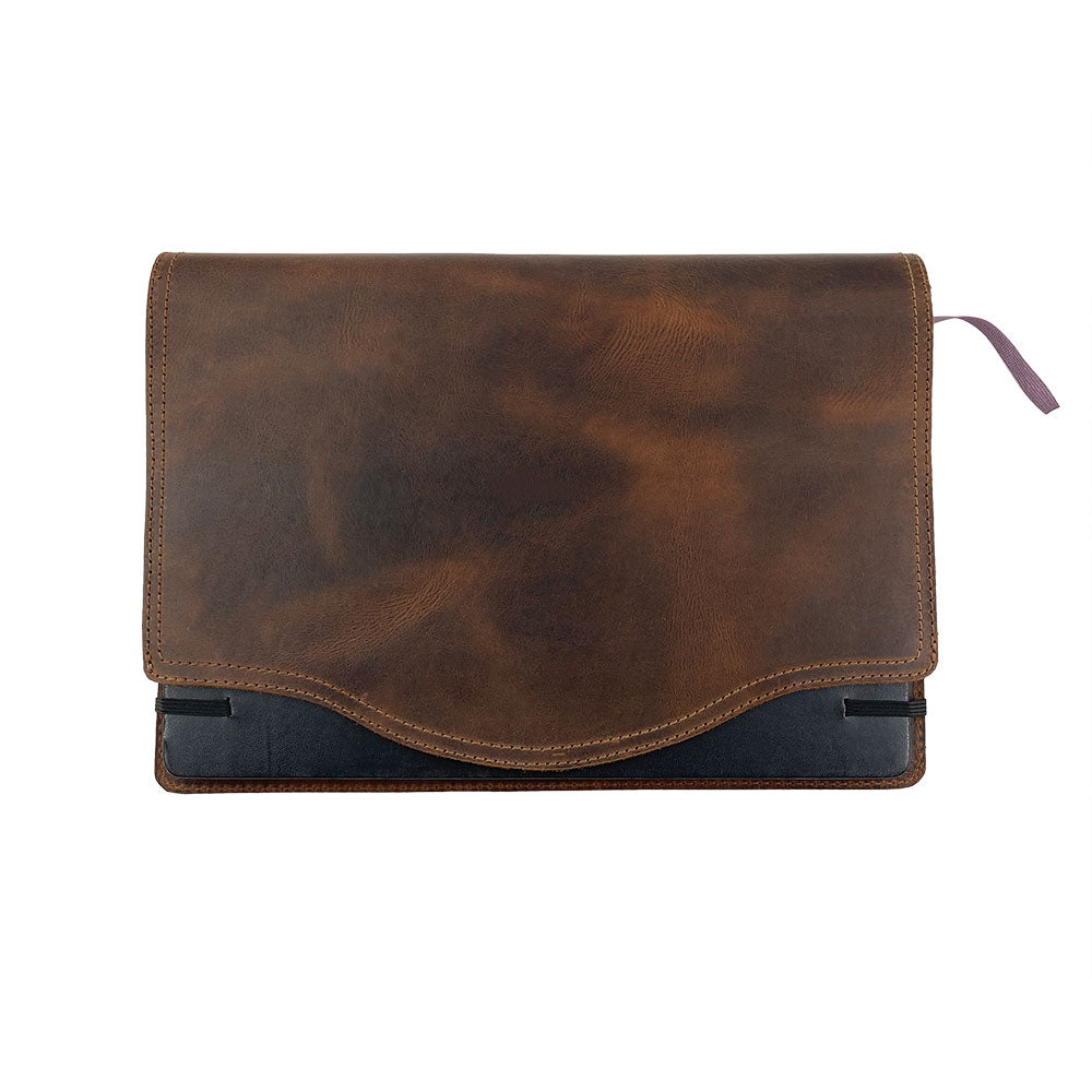 The front view of the Hard Cover Notebook Protector (Notebook NOT Included) by Hide & Drink, featuring its sleek design. Perfect for Moleskine Hard Cover Sketchbook XXL Size (8.5 x 11 in.), this journal cover utilizes high-quality Full Grain Leather. It's created through StockyardX's small batch production, including hand cut, hand sewn, and fire branded finishes by artisans. Handmade in La Antigua Guatemala & Oaxaca Mexico.