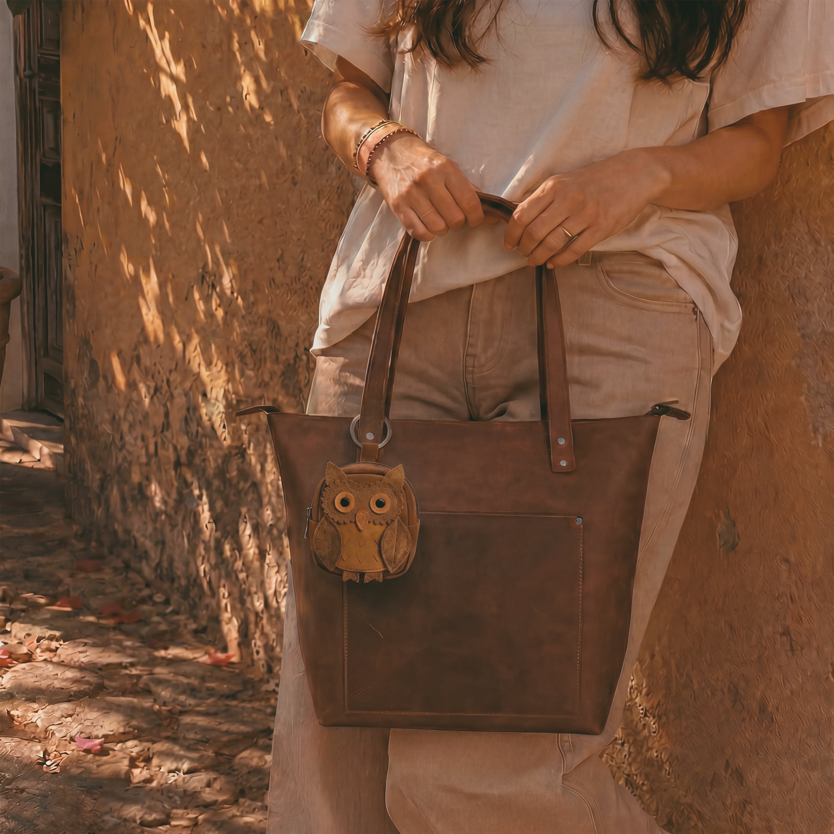 Owl Mini Backpack by Hide & Drink, this adorable owl-shaped case serves as a perfect Owl Mini Backpack Coin Purse and Cute Keychain. Ideal for holding coins and small items, it boasts Full Grain Leather construction, emphasizing small batch production. Hand cut, hand sewn, fire branded, and crafted by skilled artisans in La Antigua Guatemala & Oaxaca Mexico.