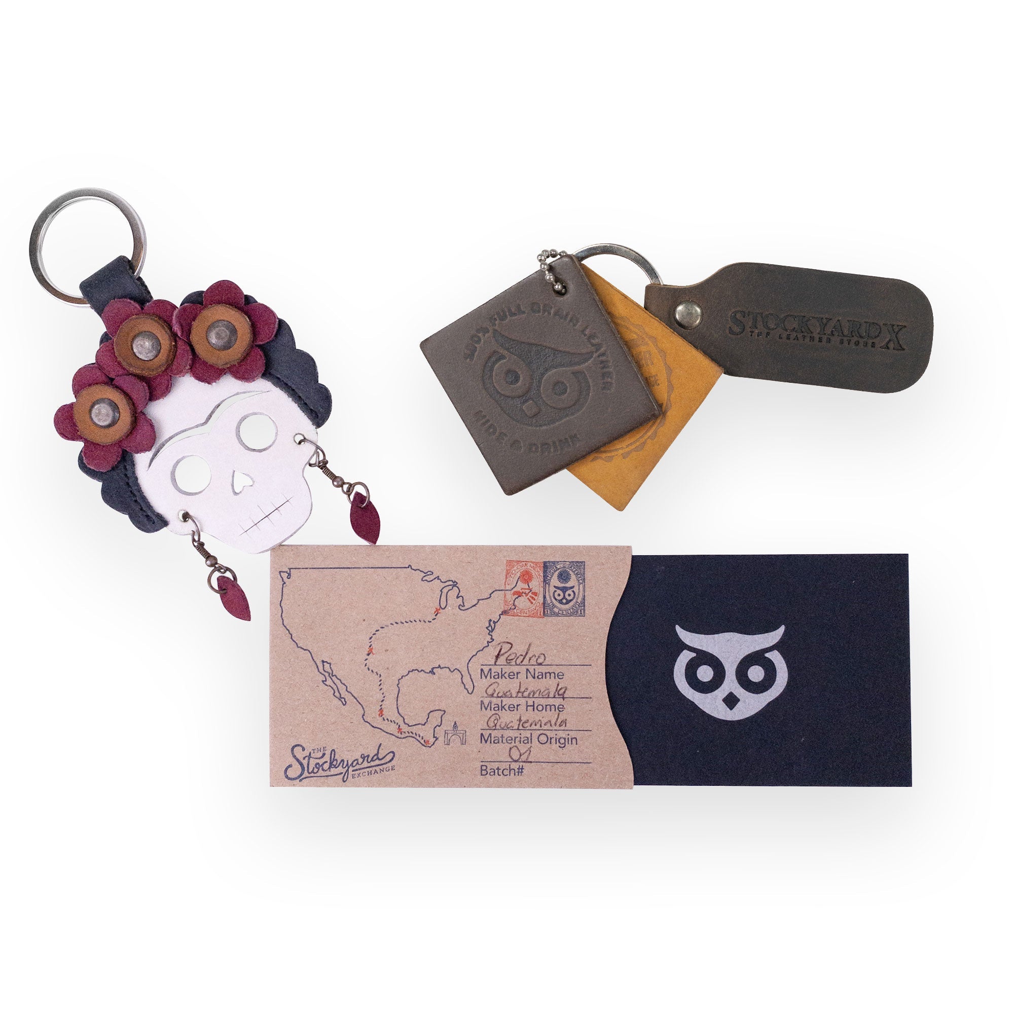 The Lady Skull Leather Keychain by Hide & Drink displayed alongside other accessories, emphasizing its unique Dia De Los Muertos design. This keyring not only serves as a practical key organizer but also captures the essence of Mexican culture, made from high-quality Full Grain Leather by artisans in La Antigua Guatemala and Oaxaca Mexico.