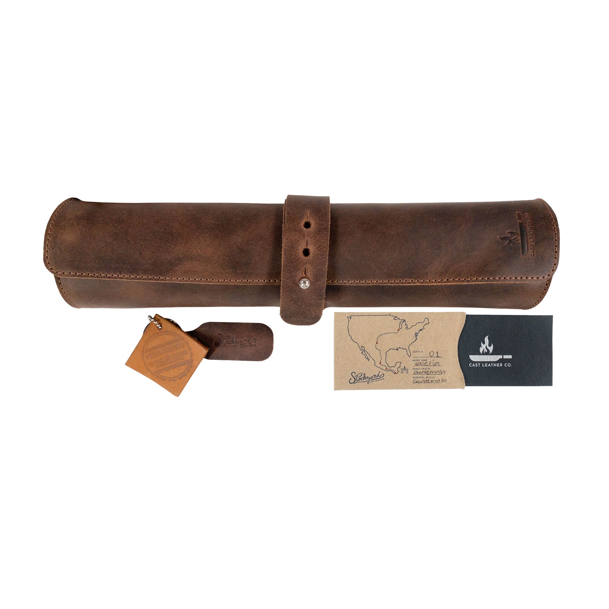 Rectangular Knife Case with 3 Slots by Cast Leather Co. displayed with gift tags, highlighting its unique craftsmanship. This artisan Portable Knife Organizer serves as a perfect Travel Bag for culinary accessories, combining the beauty of Full Grain Leather with small batch production from Oaxaca Mexico.
