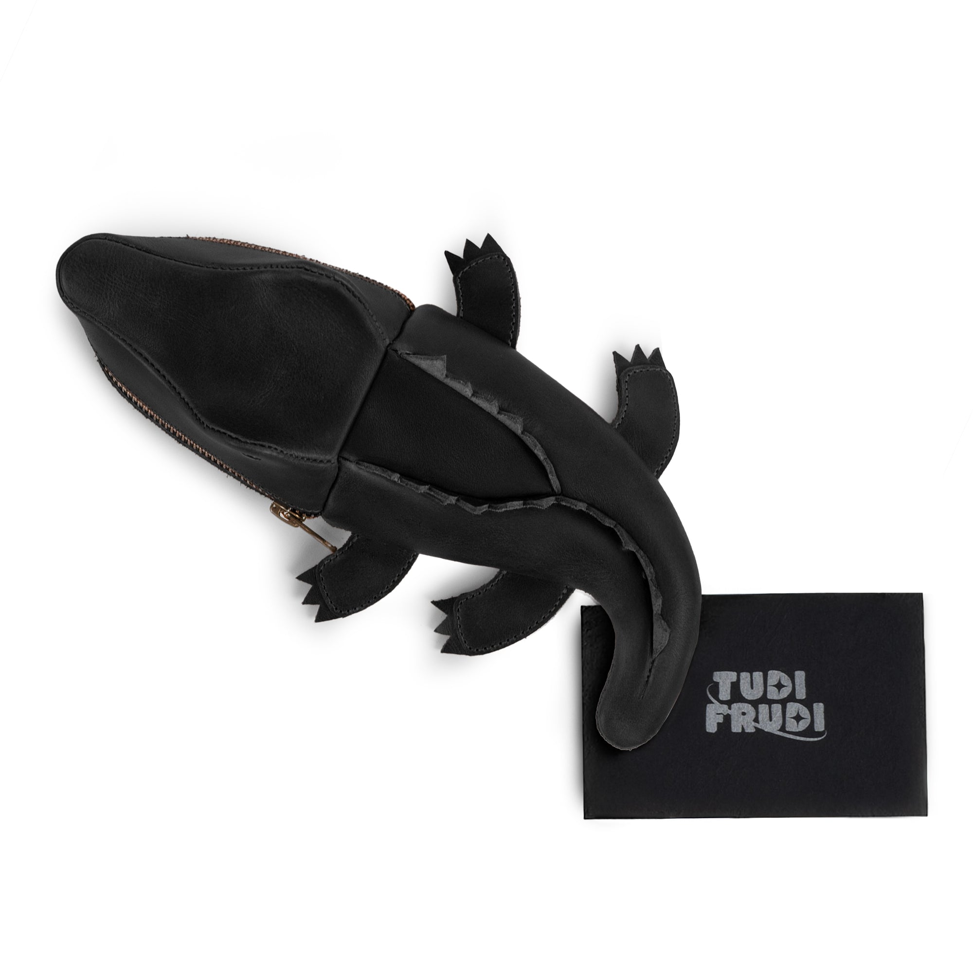 Leather Gator Pouch by Tudi Frudi, photographed with packaging, exuding artisanal charm. This alligator-shaped pouch is perfect for organizing cash, art supplies, or small tools, made from premium full grain leather and handcrafted in La Antigua Guatemala & Oaxaca, Mexico, perfect for gifting or personal use.