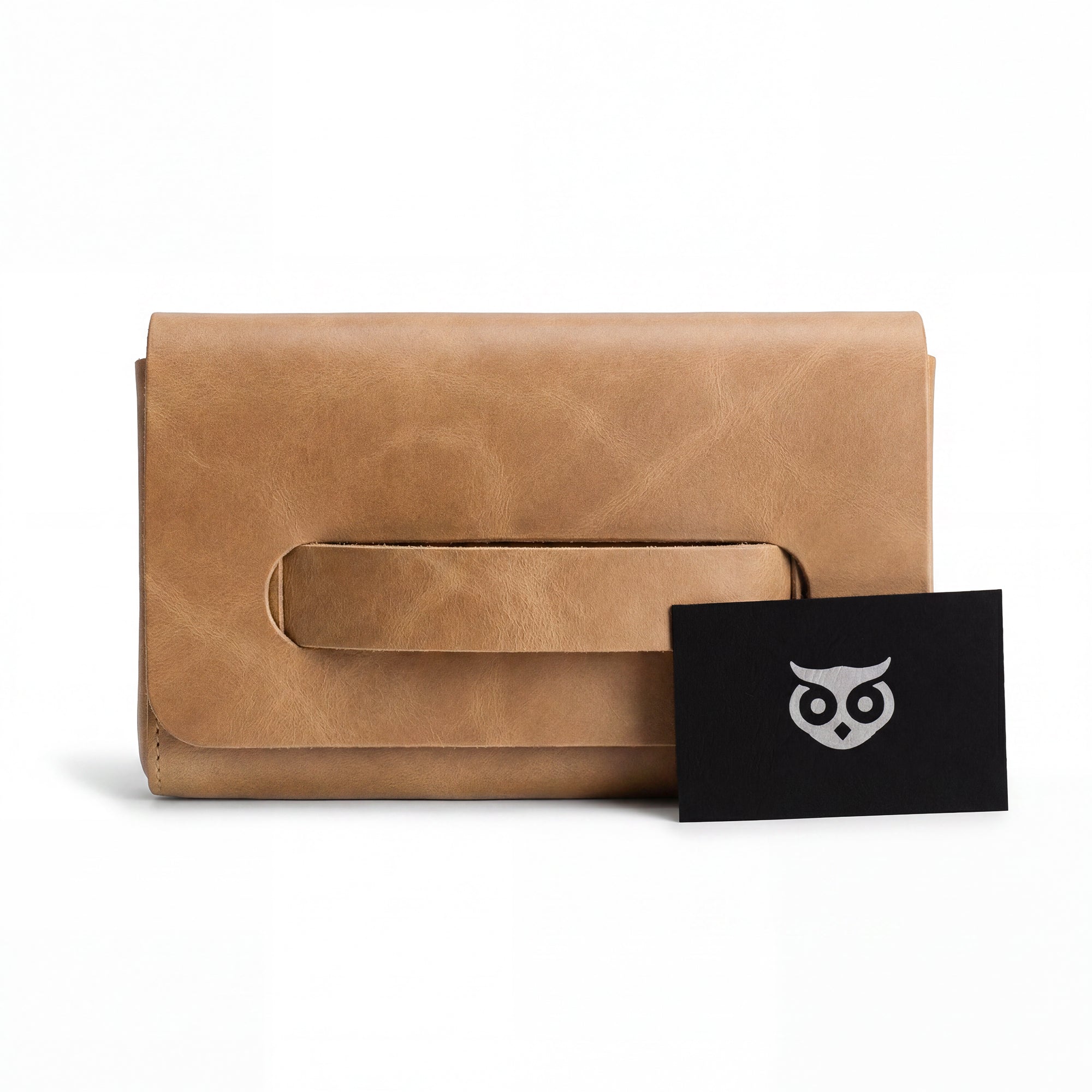 The brown Clutch Bag With Handle from Hide & Drink styled with included accessories. This Full Grain Leather Clutch Bag is a perfect gift for women, handmade through small batch artisan production in La Antigua Guatemala & Oaxaca Mexico.