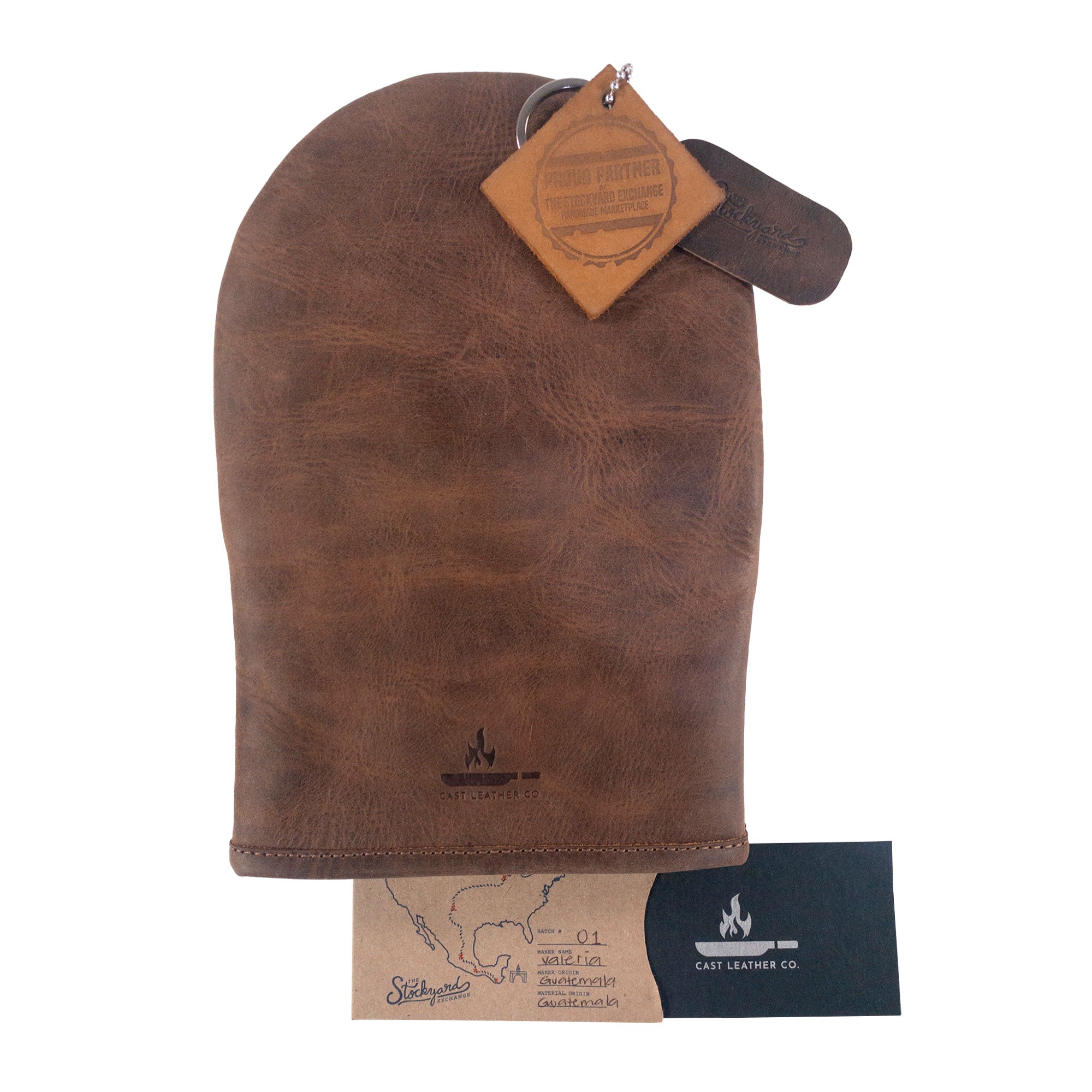 Dimensions of the Cast Leather Co. Dual-Hand Leather Oven Mitt displayed with measurements, highlighting its practicality and ergonomic design. This kitchen essential, crafted from Full Grain Leather, serves as an excellent hand protector for baking, part of small batch production in La Antigua Guatemala & Oaxaca Mexico.