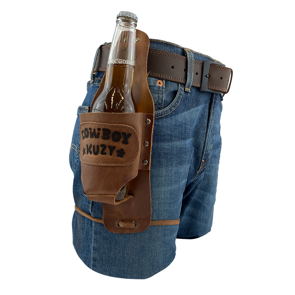 Beer Holster Stitched Designs by Hide & Drink displayed with a bottle inserted, attached to a belt, demonstrating its handsfree functionality. This Beer Holster for Cowboy is perfect for events, made from rich Full Grain Leather, suitable for both men and women, and showcases the small batch production quality with hand cut and hand sewn precision, artisan fire branding, handmade in La Antigua Guatemala & Oaxaca Mexico.