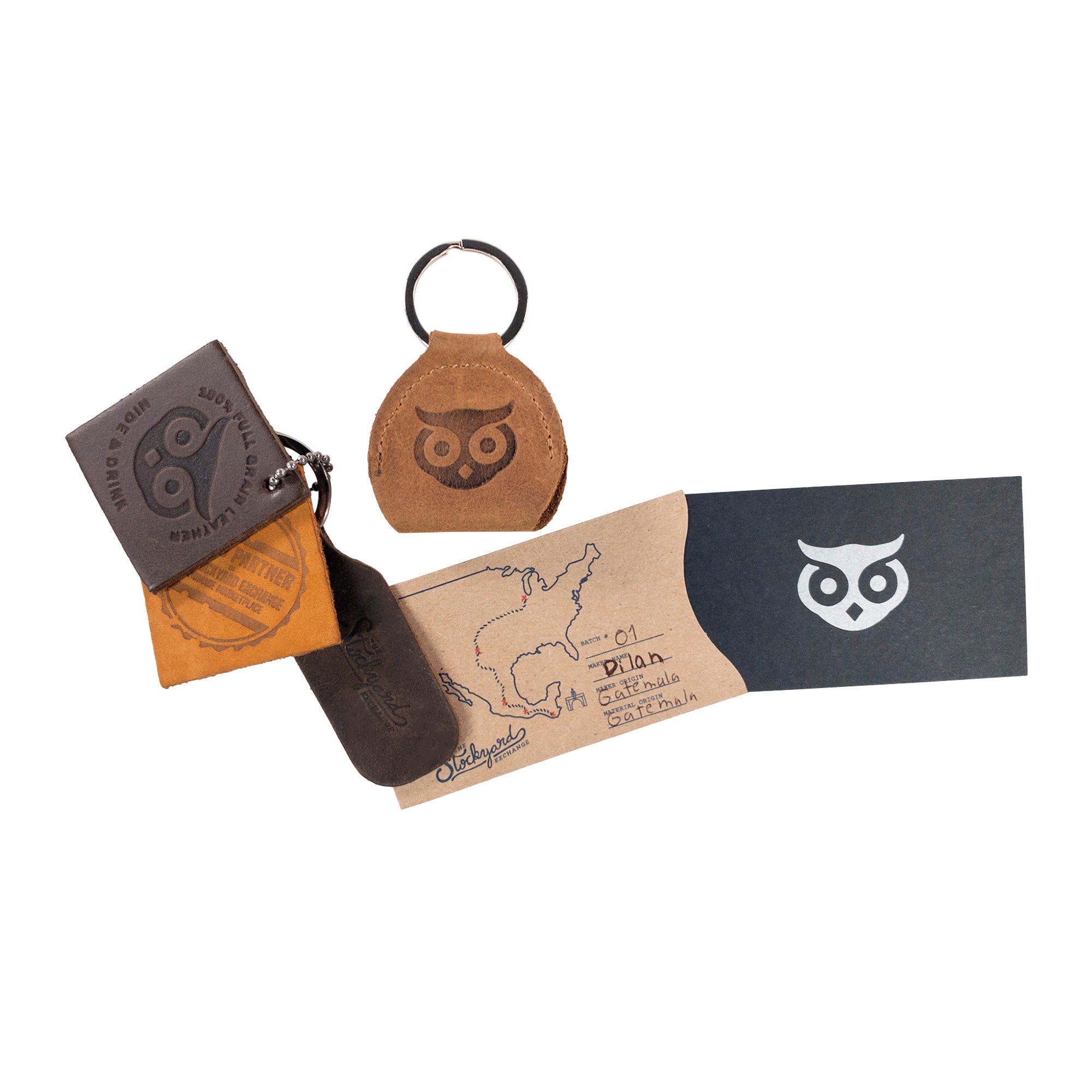 The Key Chain & Guitar Pick Holder from Hide & Drink is displayed with other products, emphasizing its design and craftsmanship. This Guitar Pick Holder with Ring serves as an essential key organizer for musicians. Crafted from Full Grain Leather, it reflects StockyardX's commitment to small batch production. Hand cut, hand sewn, and fire branded, this artisan piece is handmade in La Antigua Guatemala & Oaxaca Mexico.