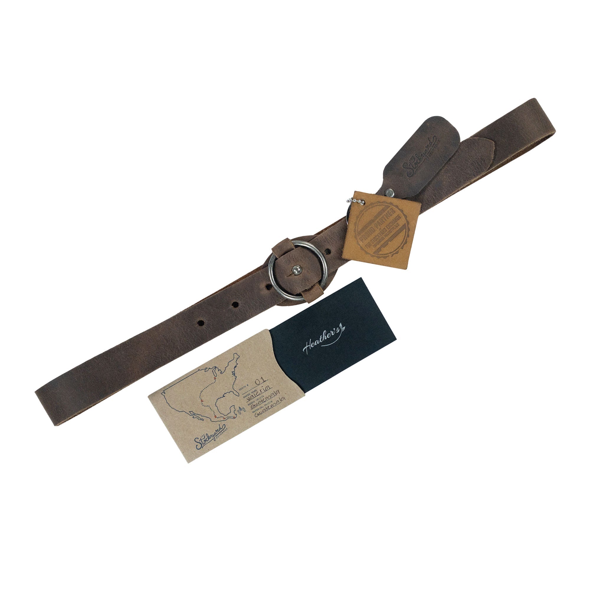 Heather's Belt for Women with Ring Closure alongside its packaging, presenting a no-buckle design made from high-quality full grain leather. This artisan belt is perfect as a stylish waist strap and a thoughtful gift, handmade in La Antigua Guatemala.