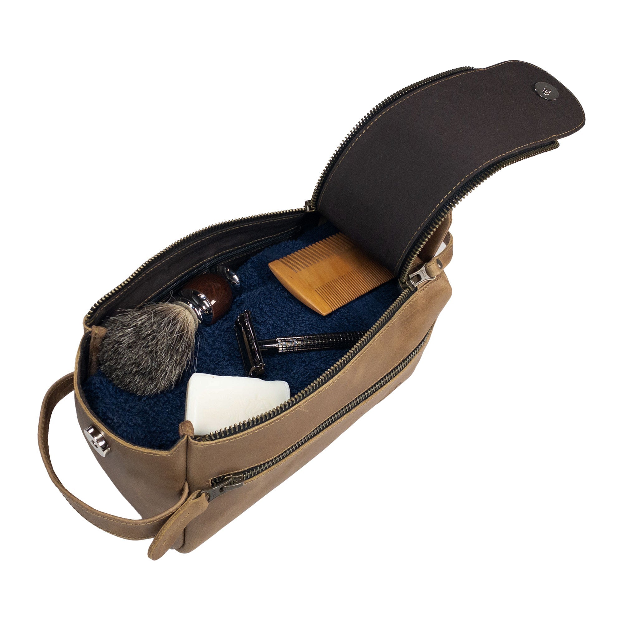 Open view of Hide & Drink's Toiletry Bag revealing grooming items inside. This Full Grain Leather Toiletry Bag doubles as a functional Hand Bag and Dopp Kit Organizer for daily use. StockyardX, Handmade, S.