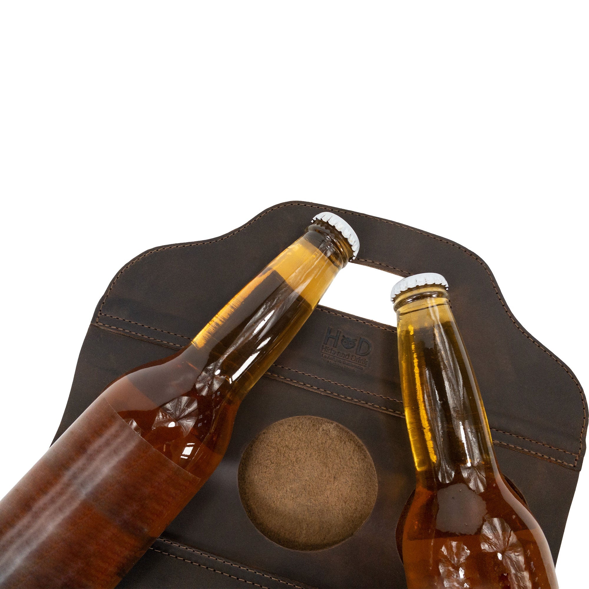 Close-up of Hide & Drink's Six Bottle Caddy with beer bottles, emphasizing its use as a Beer Holster for Bike. Made from durable Full Grain Leather, this artisan piece epitomizes Small Batch Production and is carefully hand cut and hand sewn.